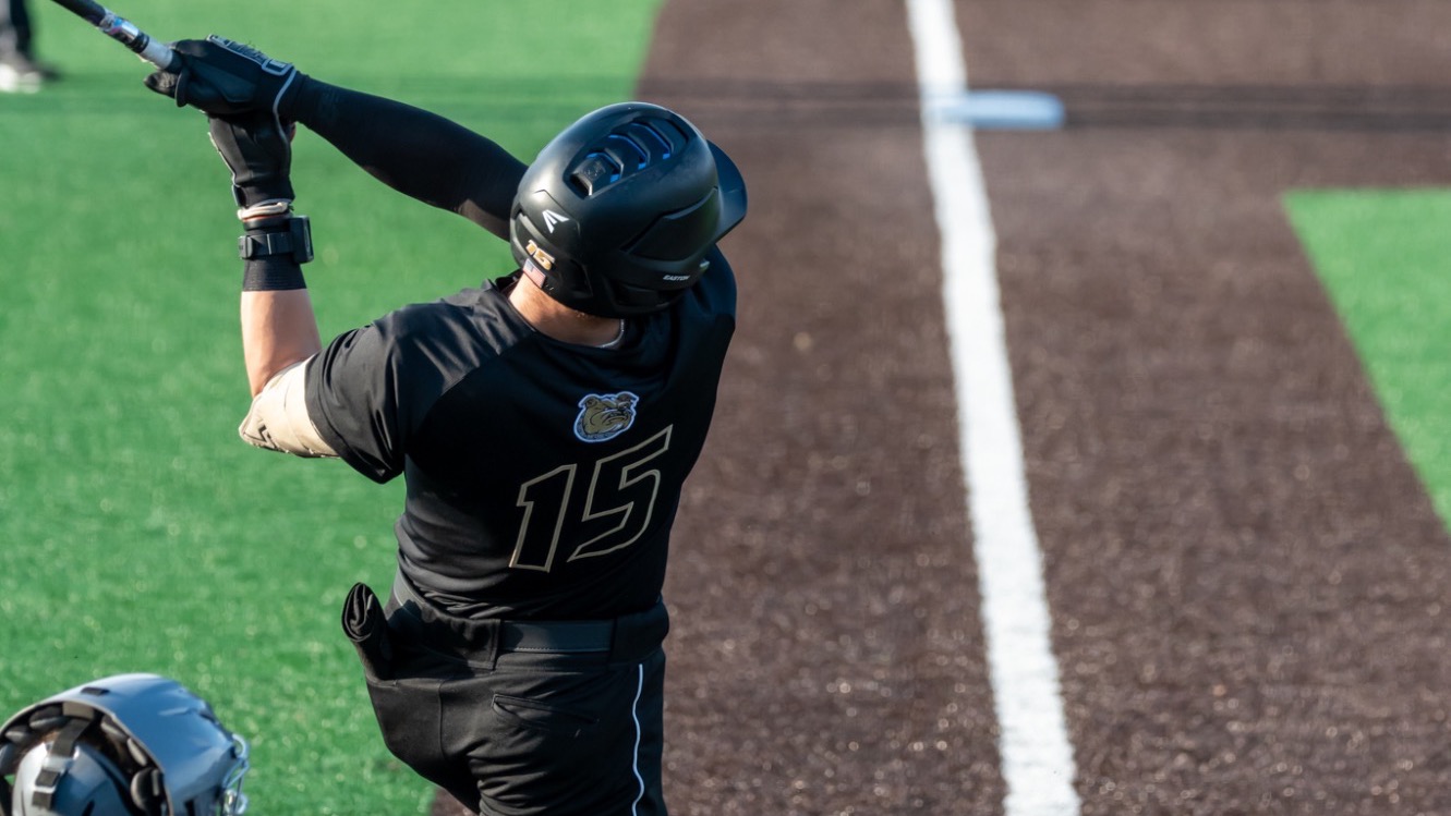 Justin Hackett finishes his home run swing vs UAlbany