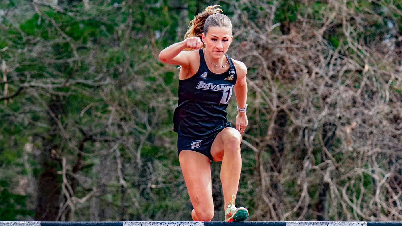 Isabel Berardino makes the leap up into the air during the steeplechase