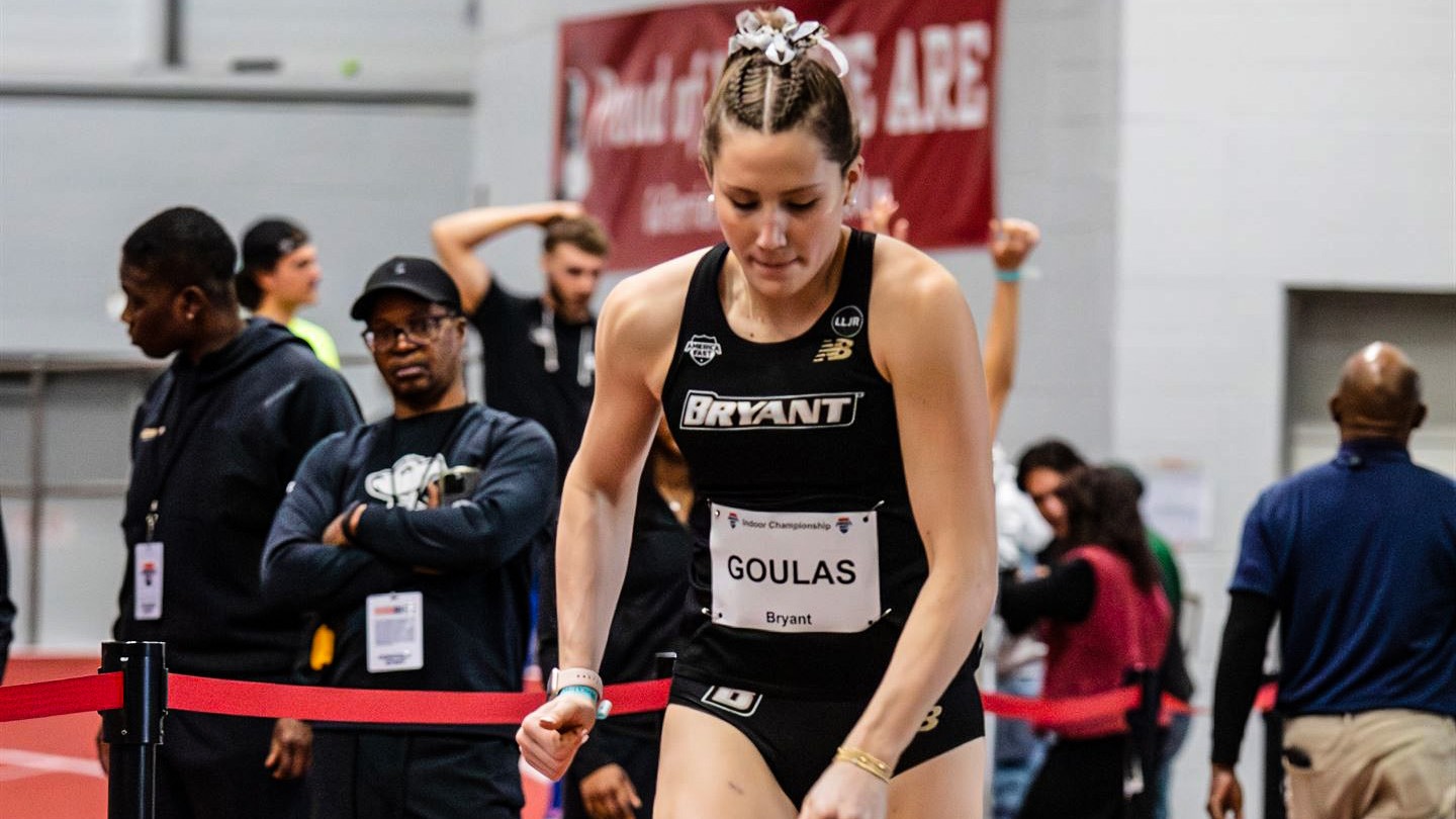 Ella Goulas runs before her long jump