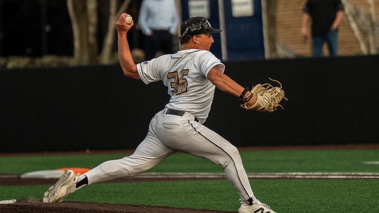 Bradley Lewis delivers a pitch against UConn