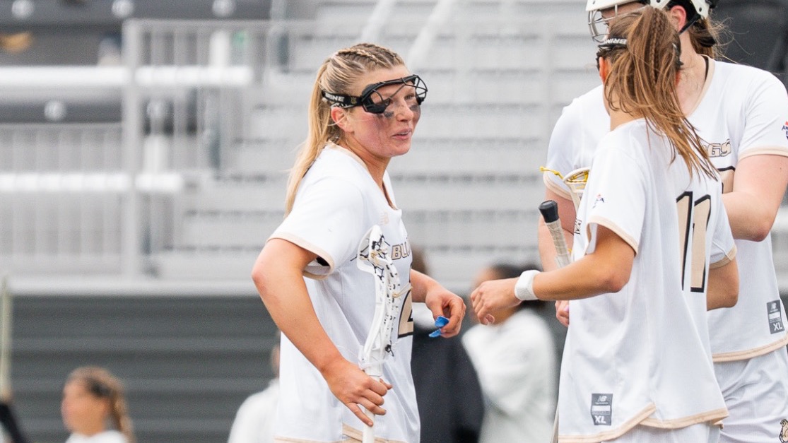 Kaelynn OBrien talks to two of her teammates