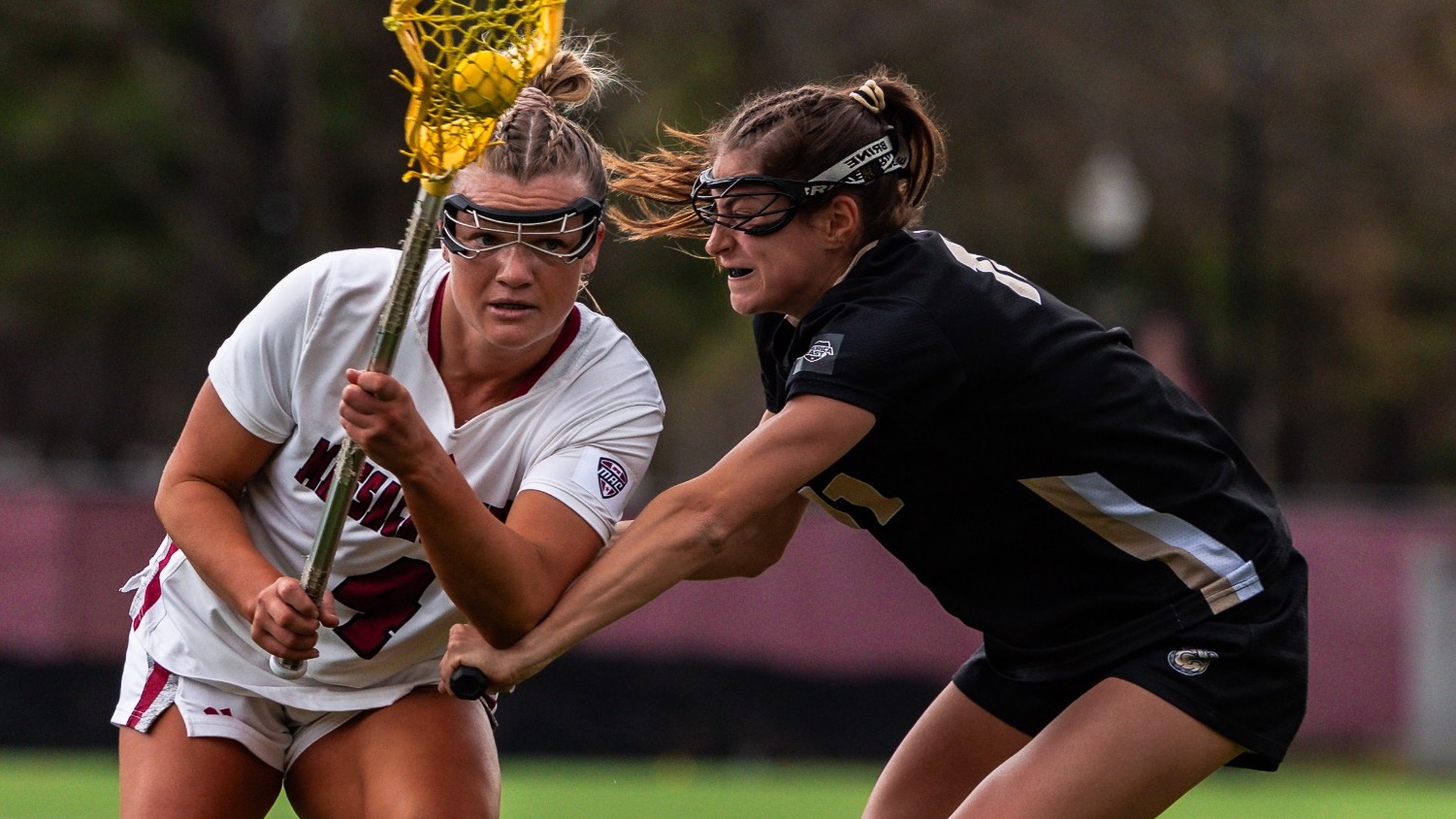 Defender puts her stick on offensive player  vs UMass