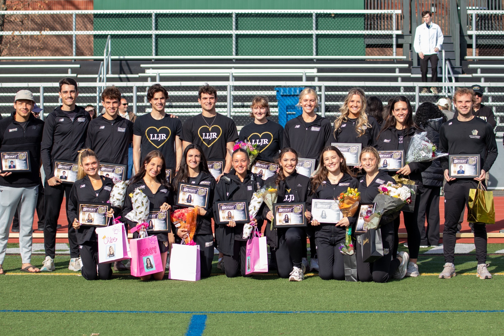 the bryant track and field team seniors taking a pictures before saturday's festivities