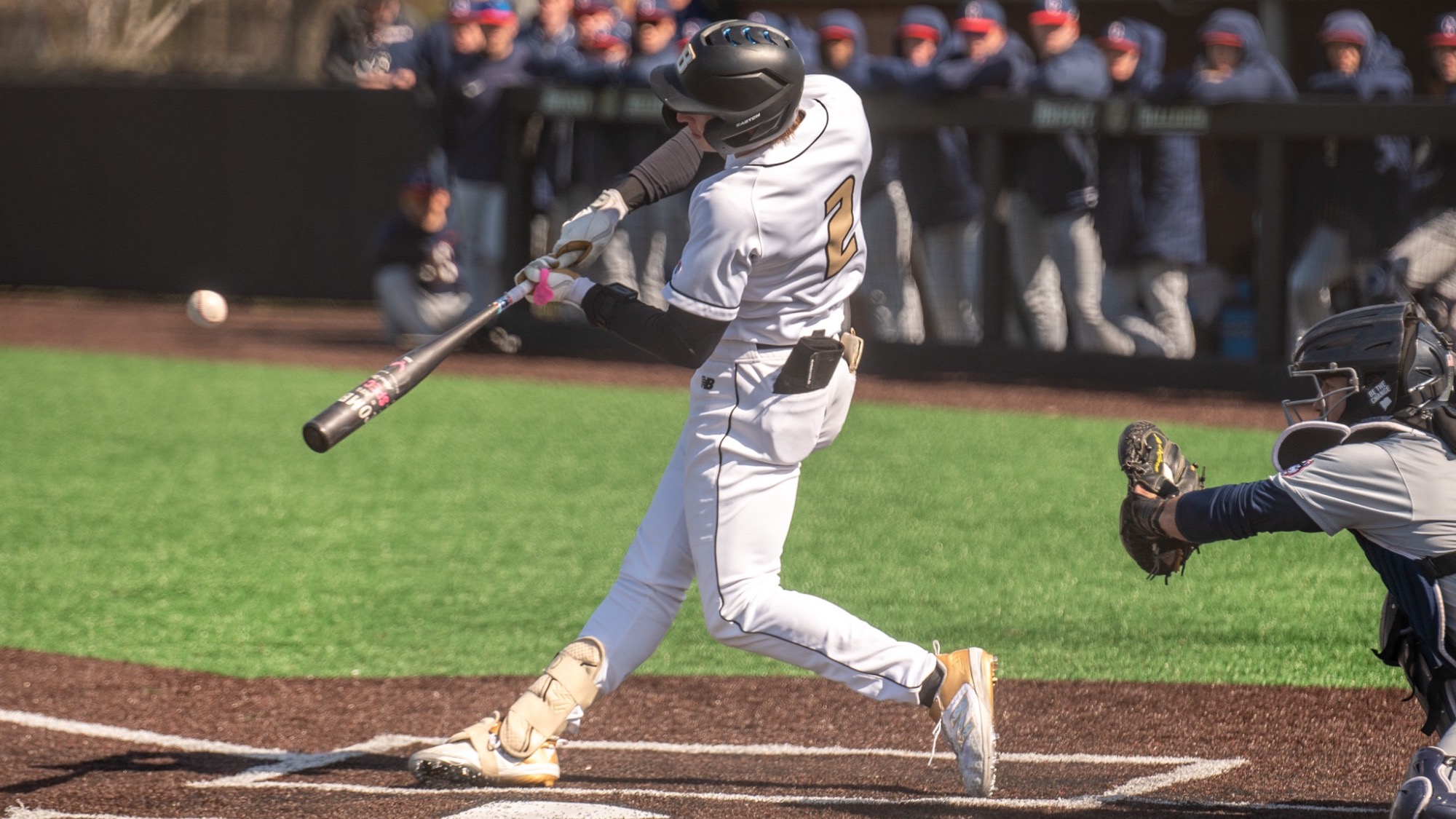Hunter Kingsbury hits a ball into center against UConn