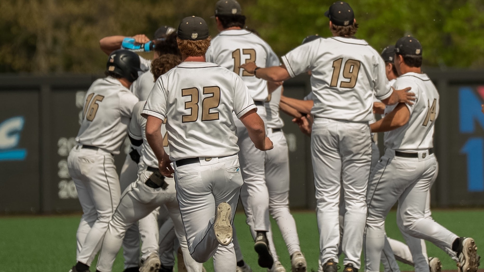 Walk off celebration for Bryant after defeating UMBC