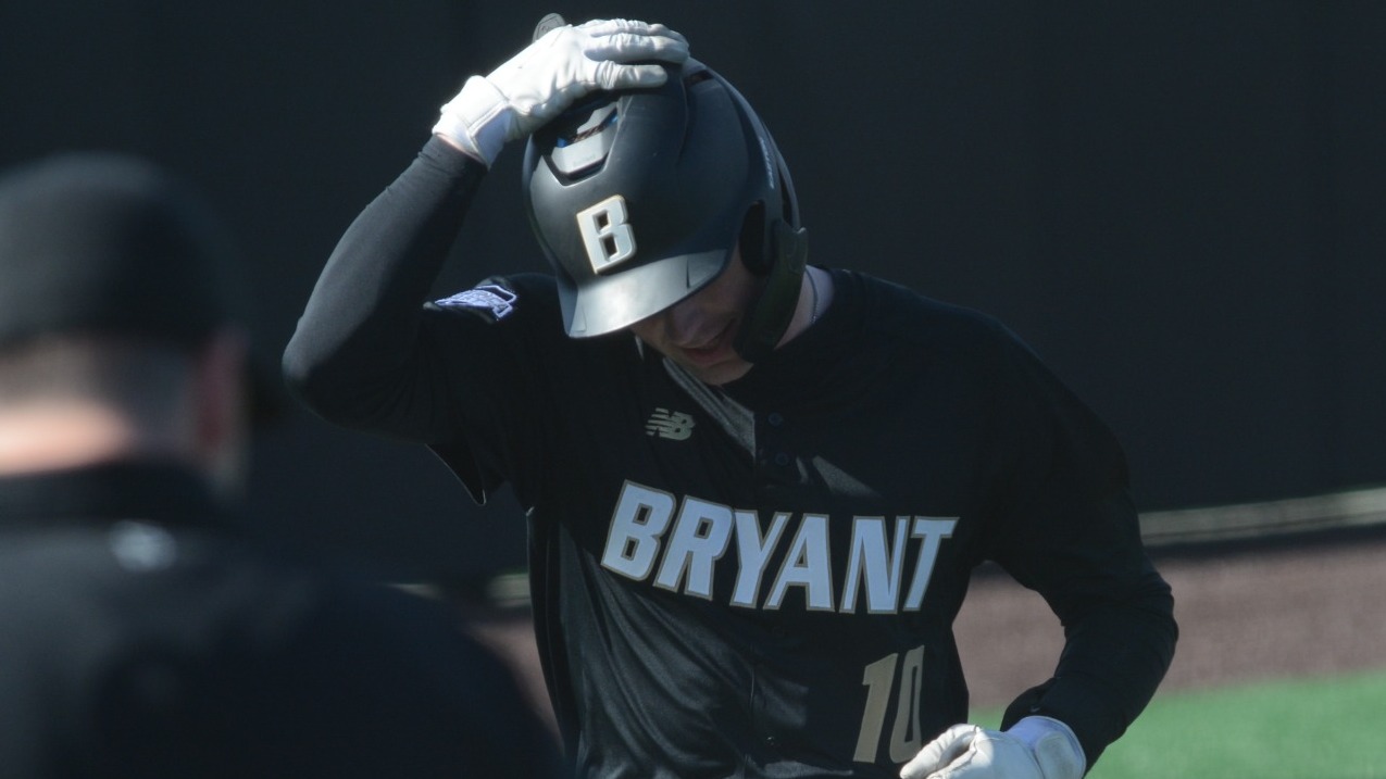 Cam Papetti Touches Helmet as he cross home plate vs Holy Cross
