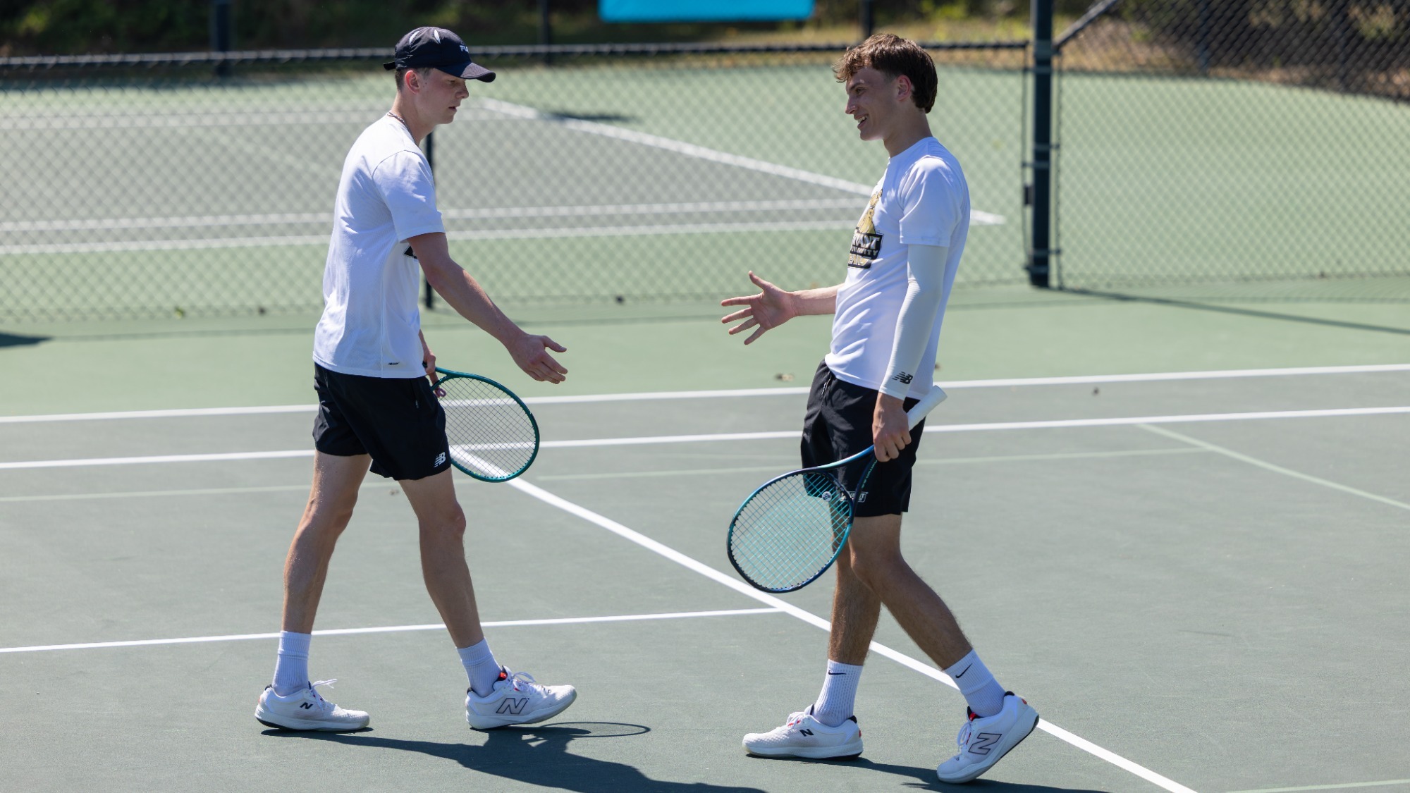 Forbes Hollingsworth and George Howard High Five Each Other