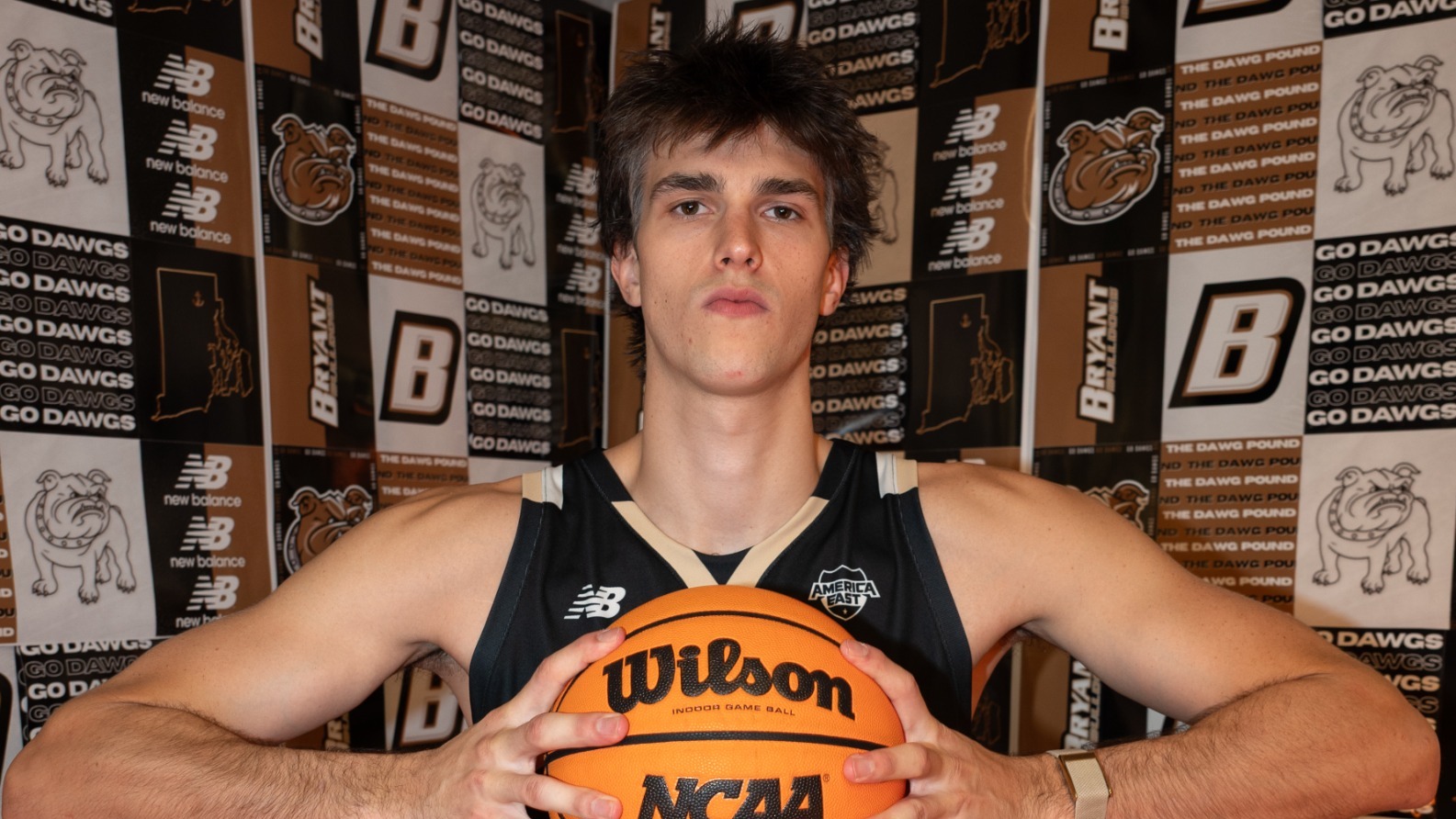 Keegan Harvey Holds the Basketball in front of wall collage