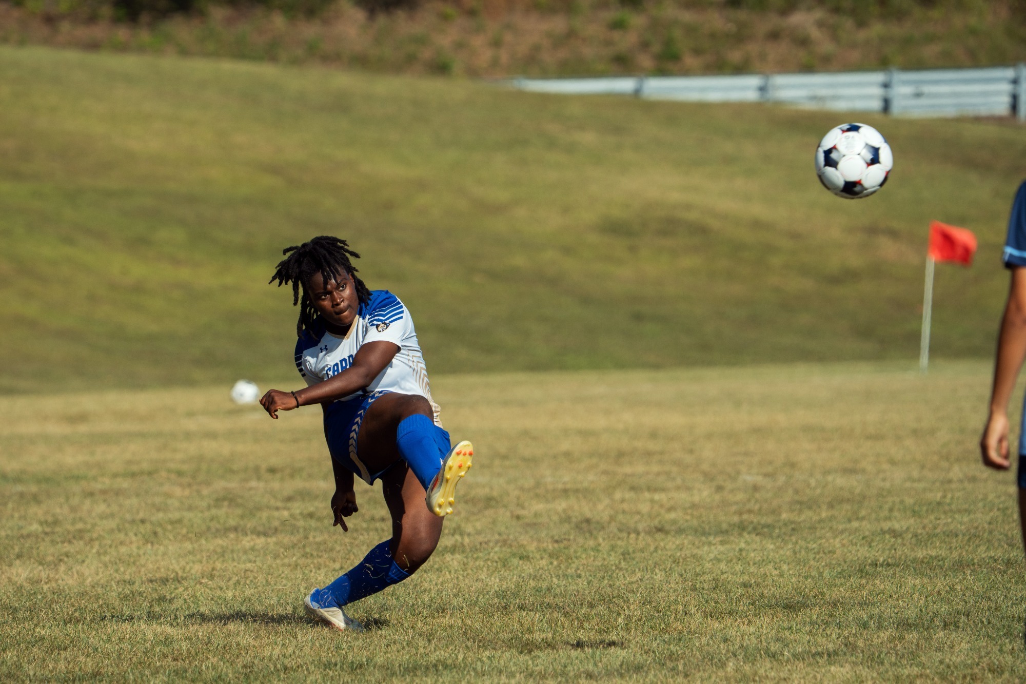 Comfort Ogunsola kicks the ball