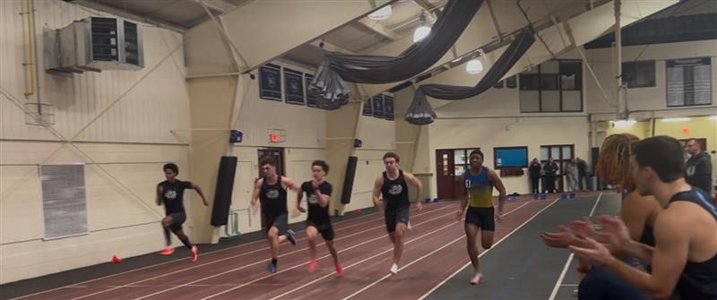 Deon storms to the front in the 55m dash semi final