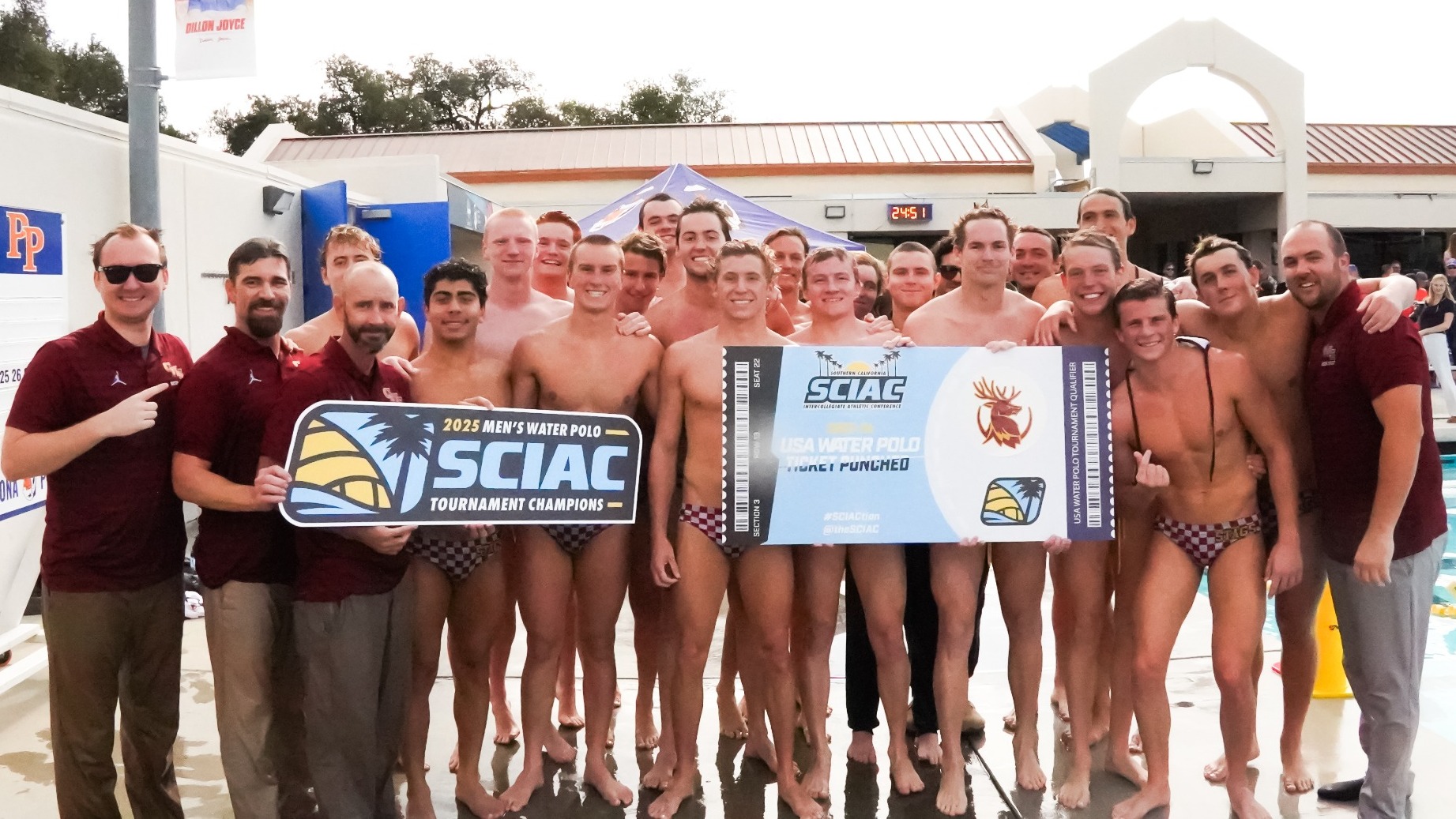 CMS Men's Water Polo team shot with the SCIAC Championship banner