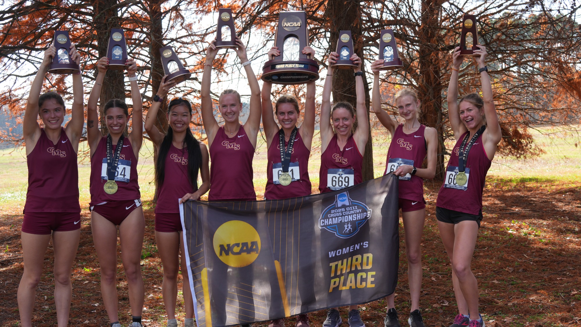 CMS Cross Country team with the third-place banner