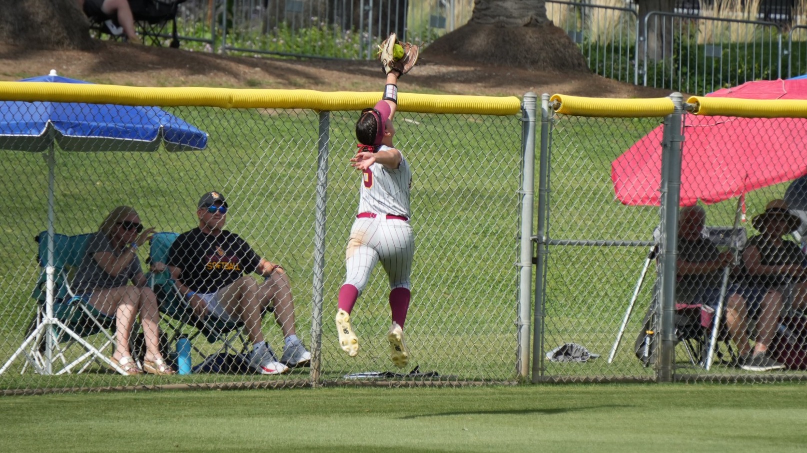 Kaili Aqui making an over the shoulder catch