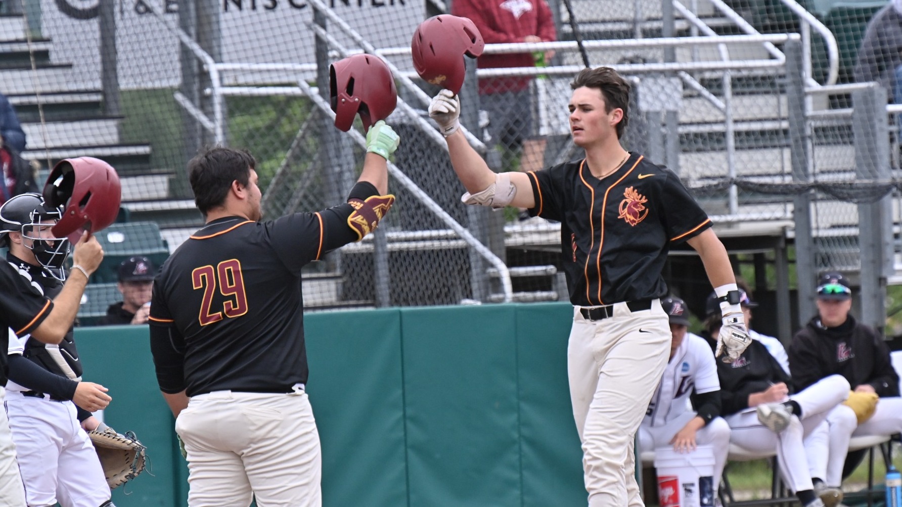 Andrew Mazzone, Alex Henderson tapping helmets