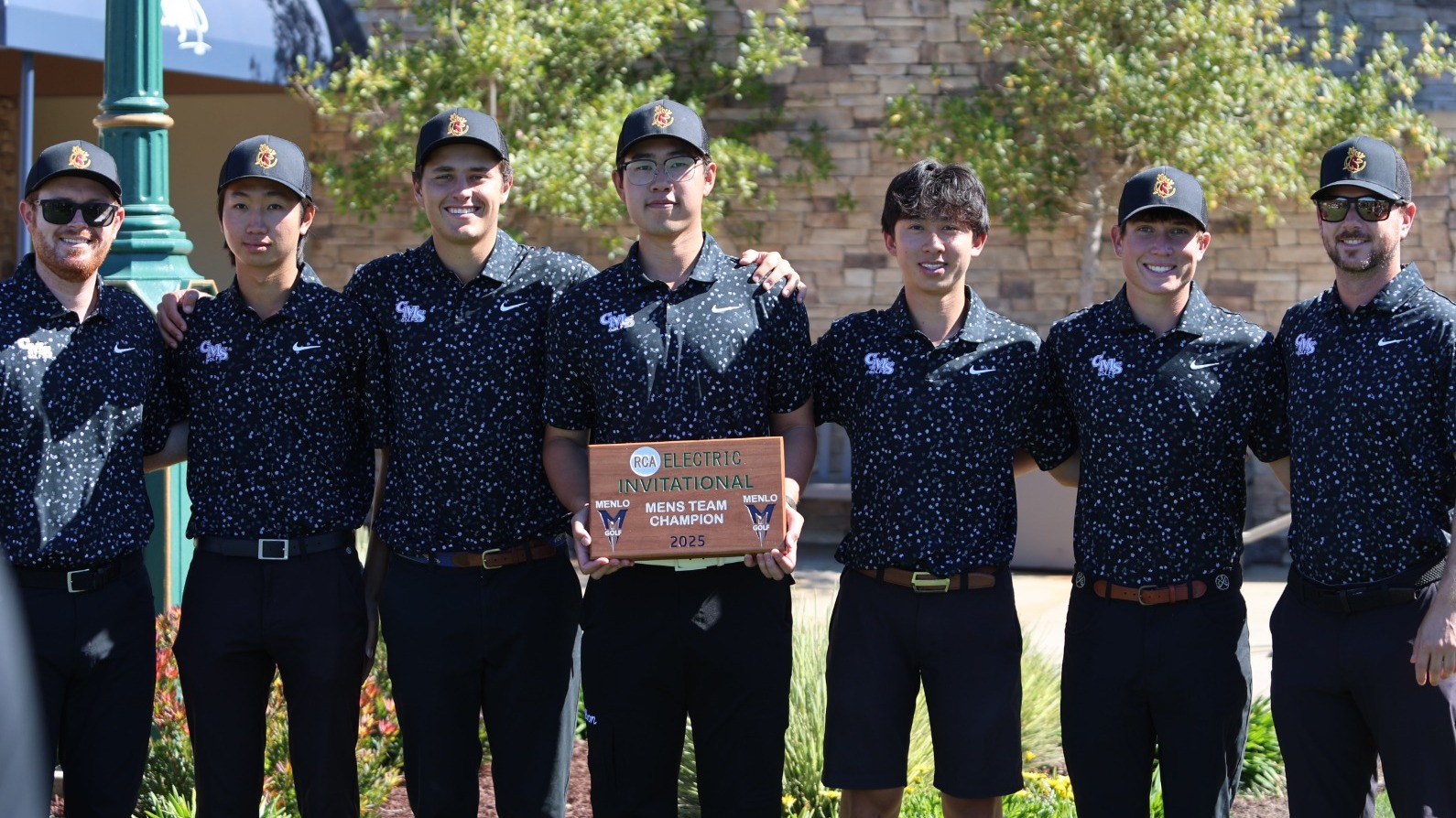 CMS Men's Golf holding the PCH Invitational championship trophy