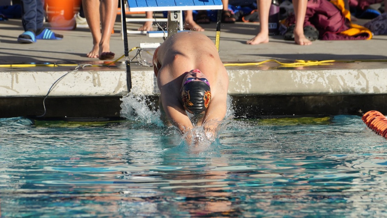 Adam Lee pushing off the wall