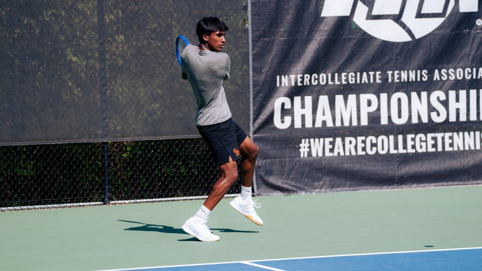 Sibi Raja hitting a backhand