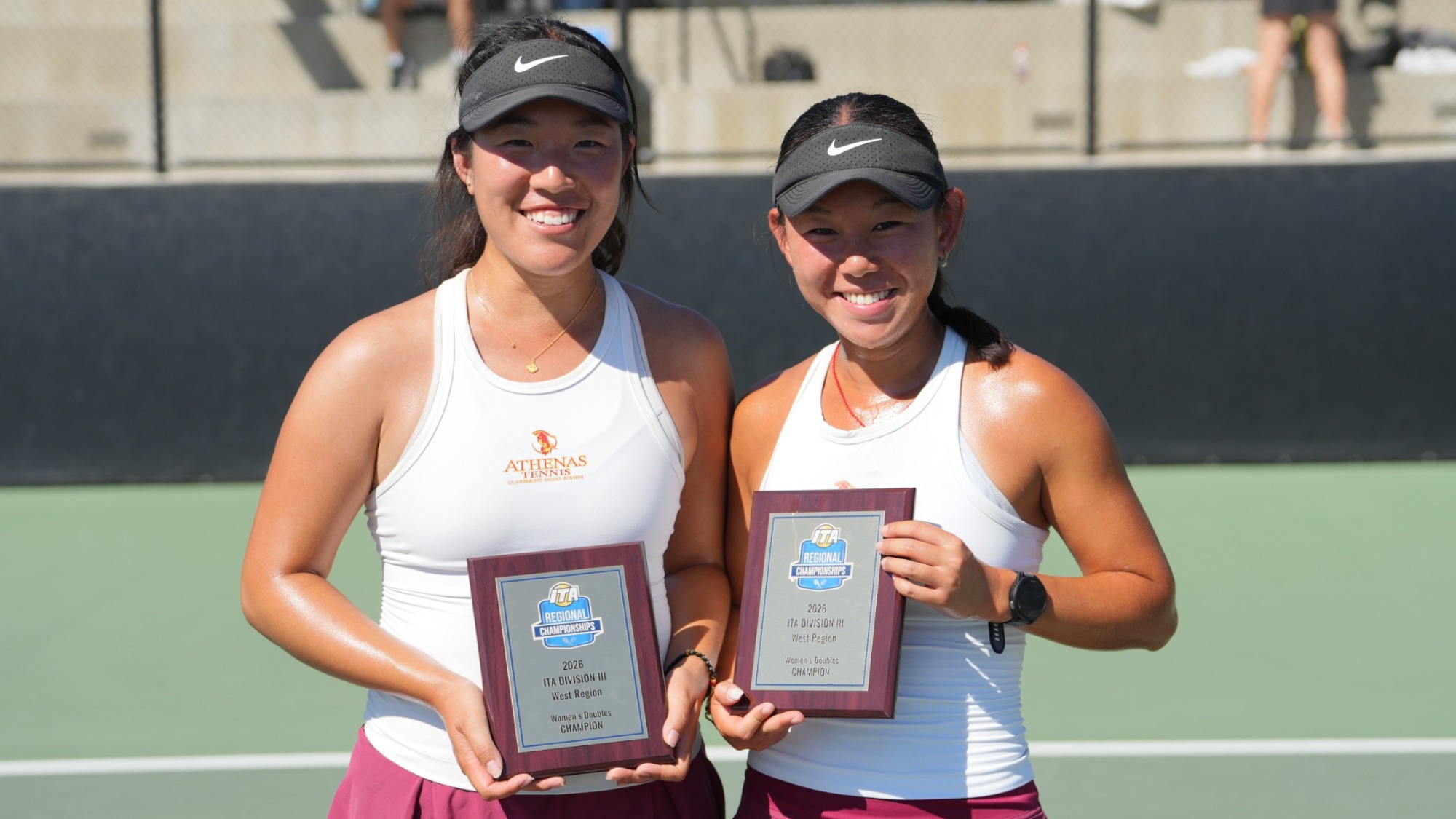 Rebecca Kong and Bell Zhou holding their ITA plaques