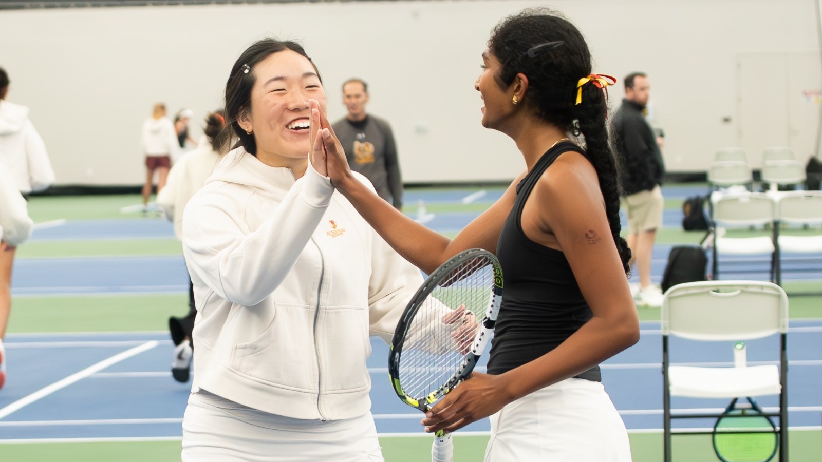 Rebecca Kong and Ananya Sriniketh hi-five 