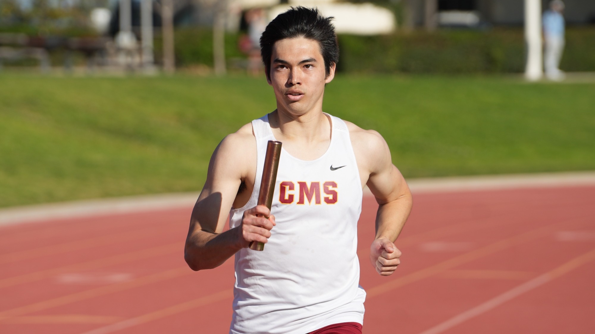 Jaden Rattay running with the baton