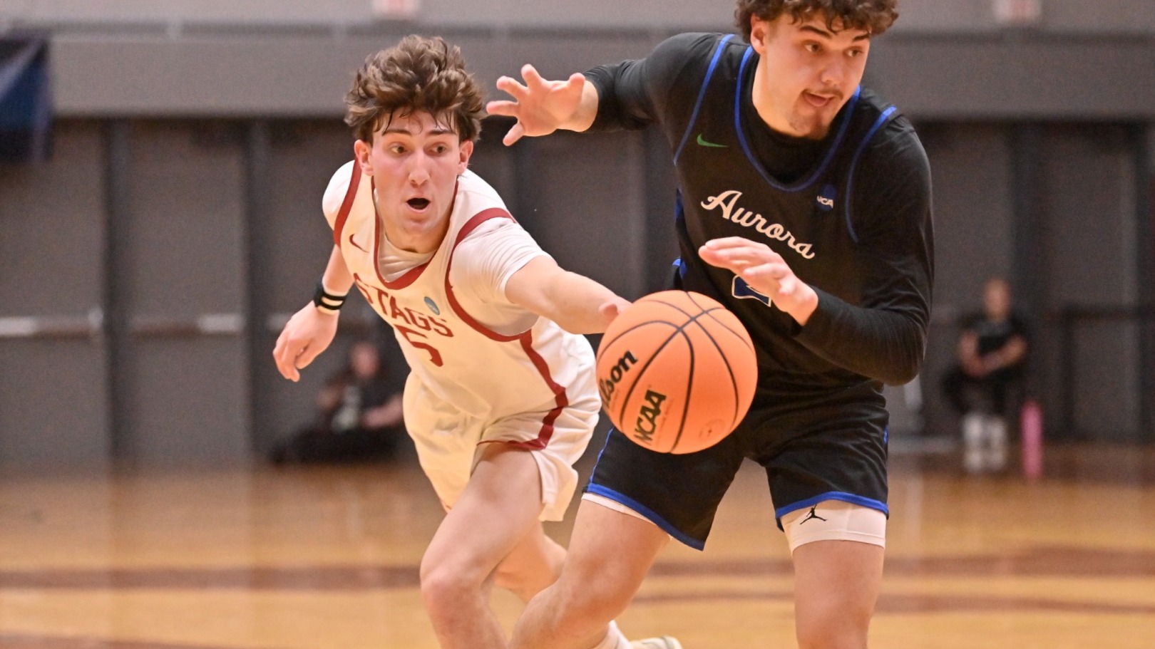 Reid Jones knocking the ball free from a dribbler
