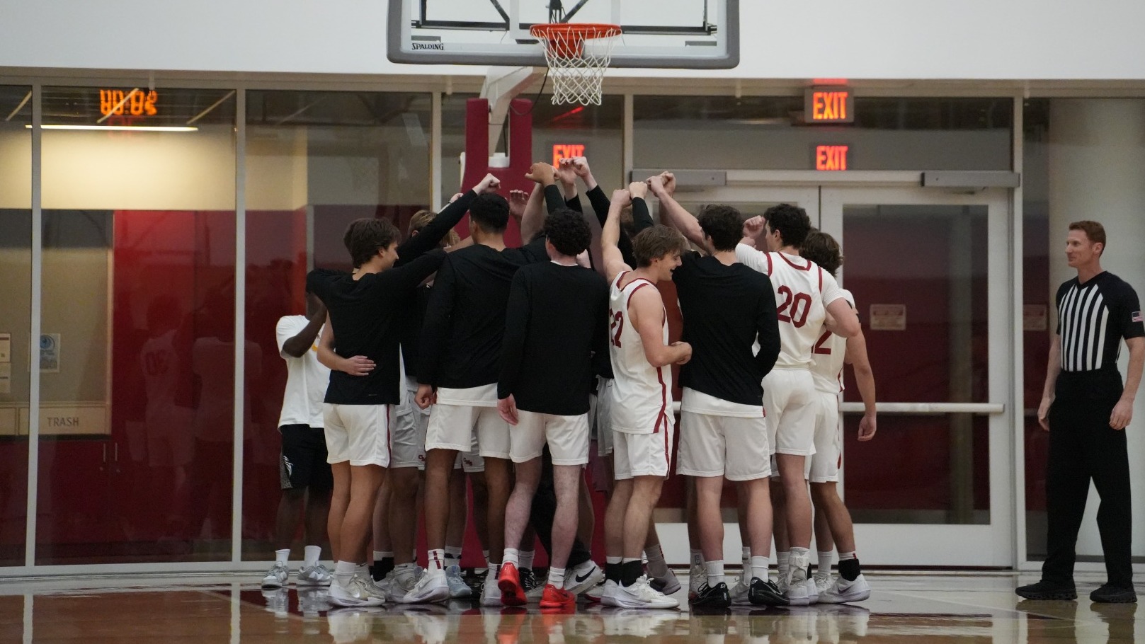 CMS Men's Basketball huddle