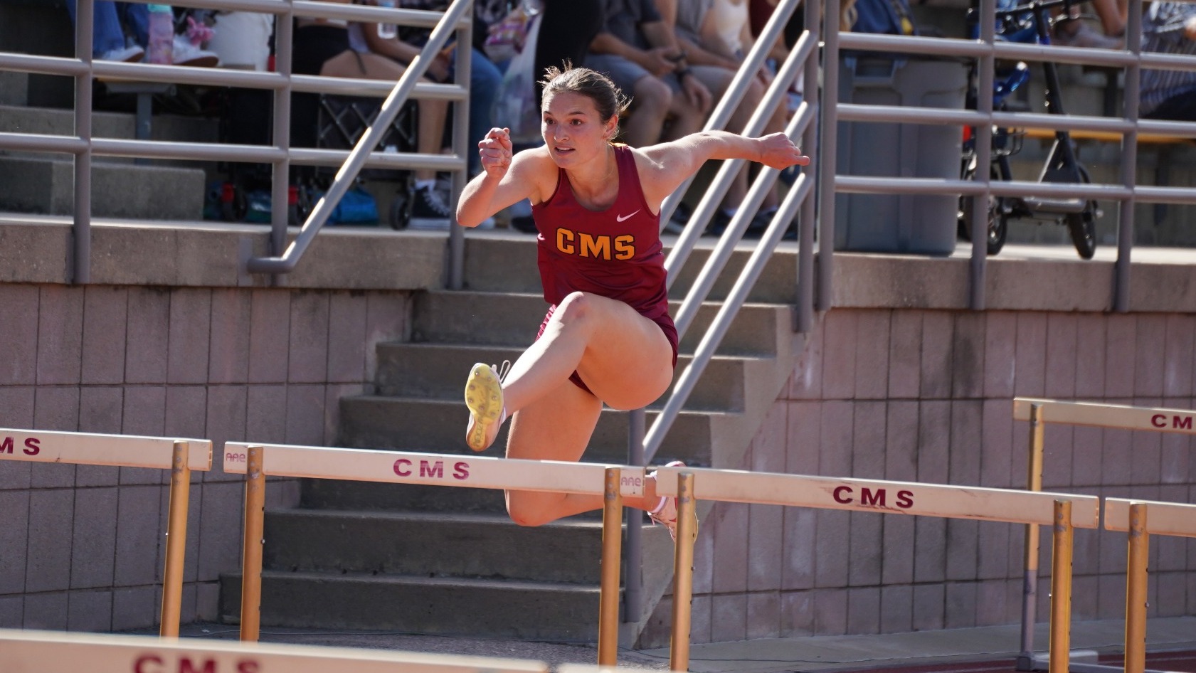 Kaitlyn Creighton competing in the hurdles