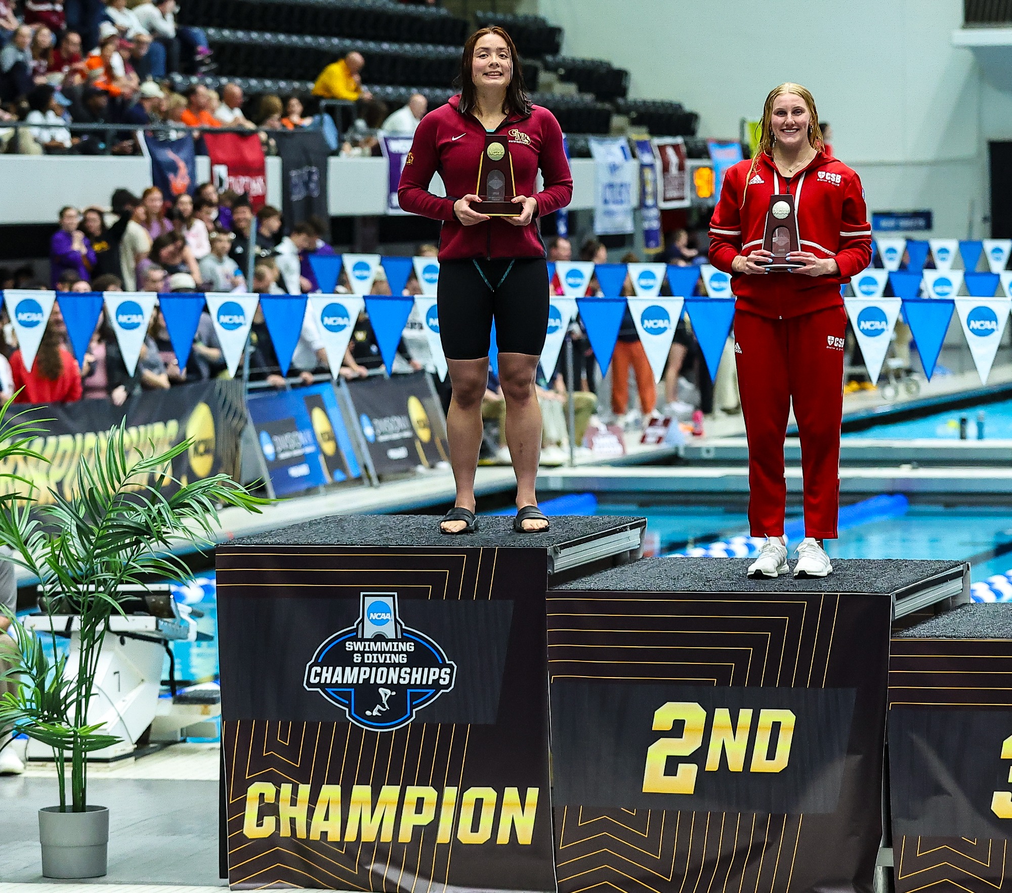 Madeleine Kan stands atop the NCAA podium