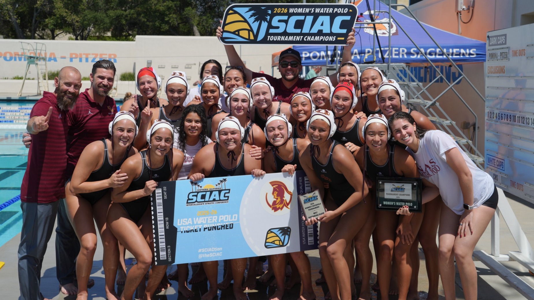 CMS Women's Water Polo holding the 2026 SCIAC Championship banner