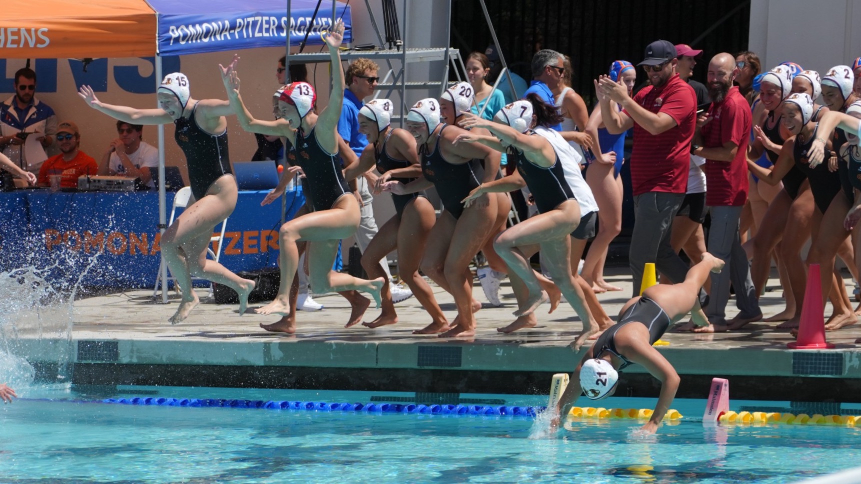 CMS Women's Water Polo jumping into the pool to celebrate the SCIAC title