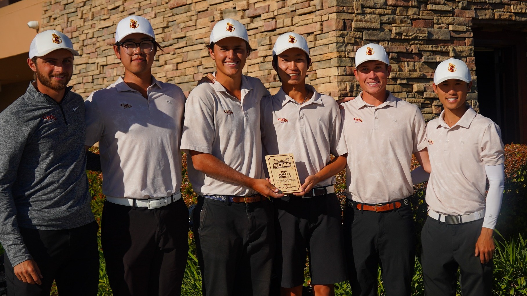 Stags Golf holding the trophy for finishing first at SCIAC No. 2
