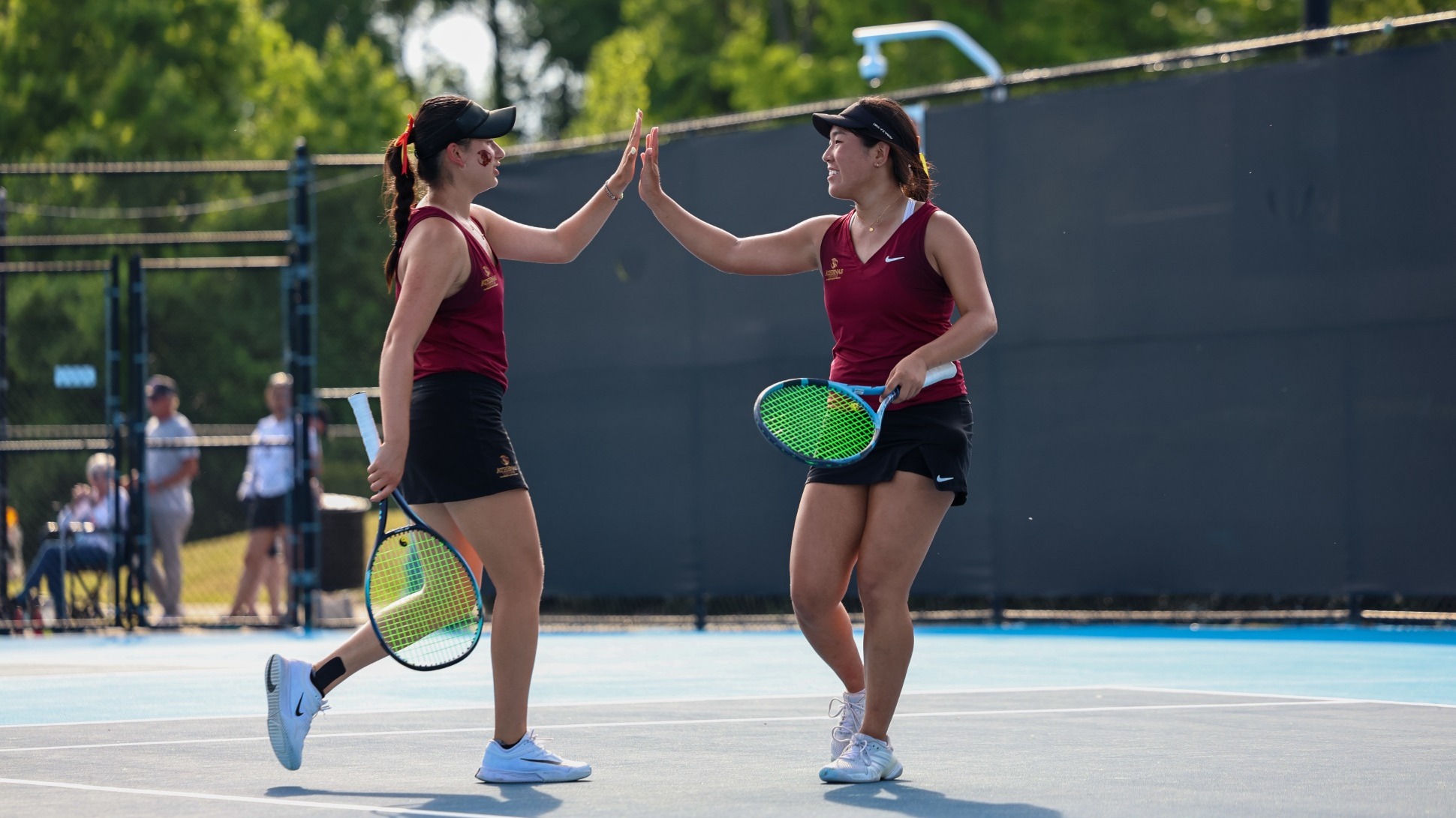 Lindsay Eisenman and Rebecca Kong High-Fiving