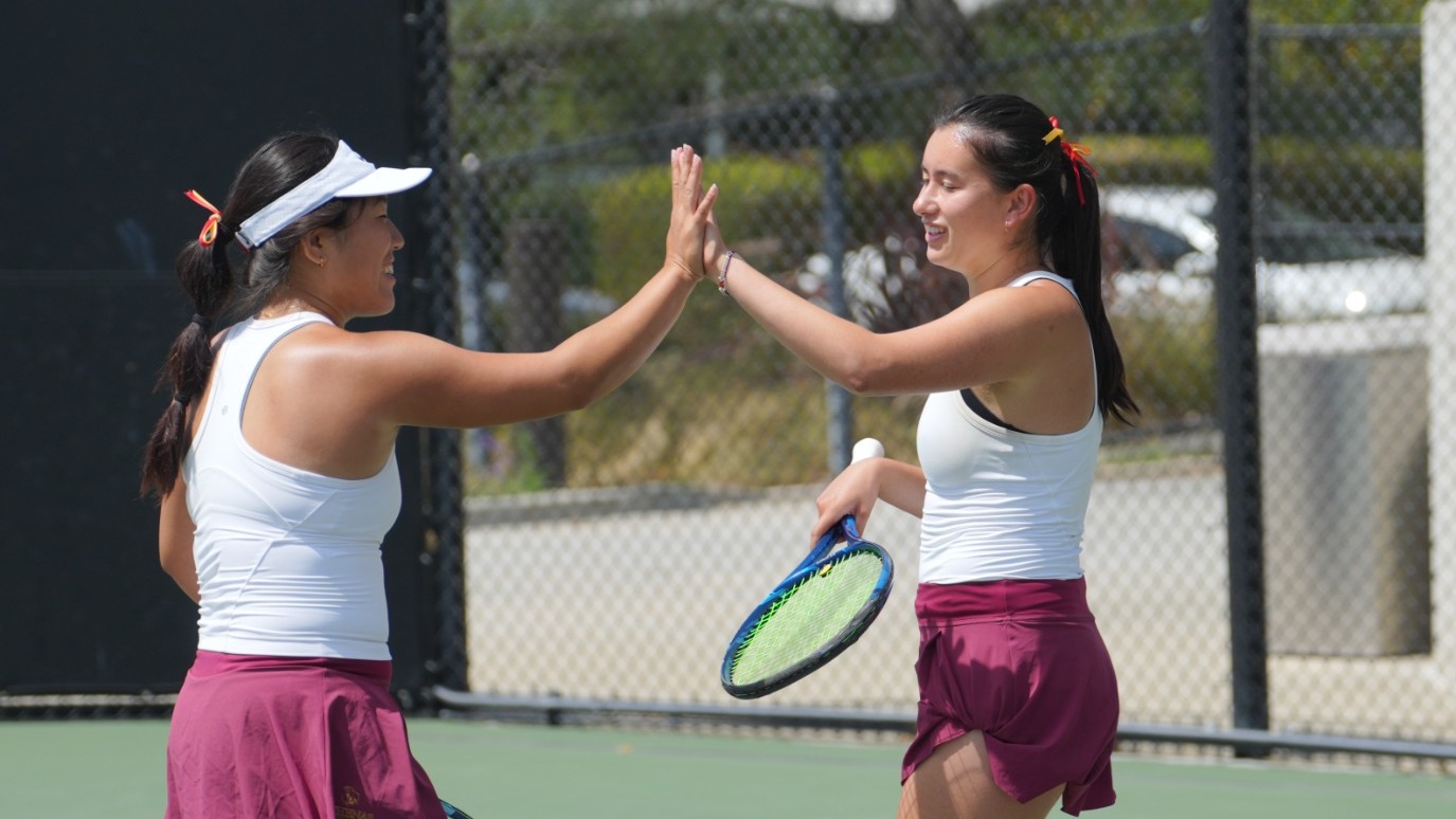Rebecca Kong and Lindsay Eisenman high fiving