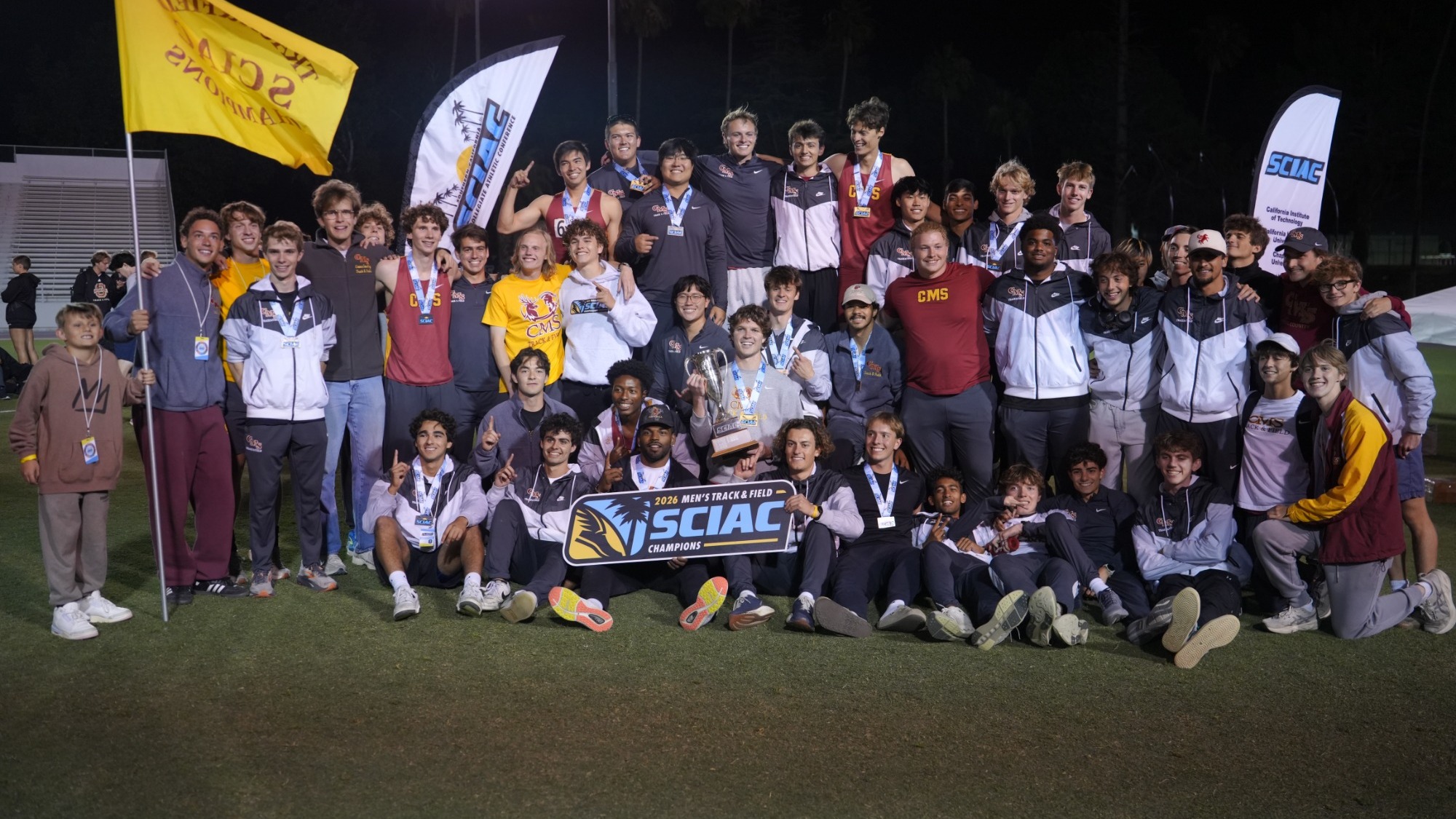 CMS Men's Track and Field team shot with the SCIAC banner