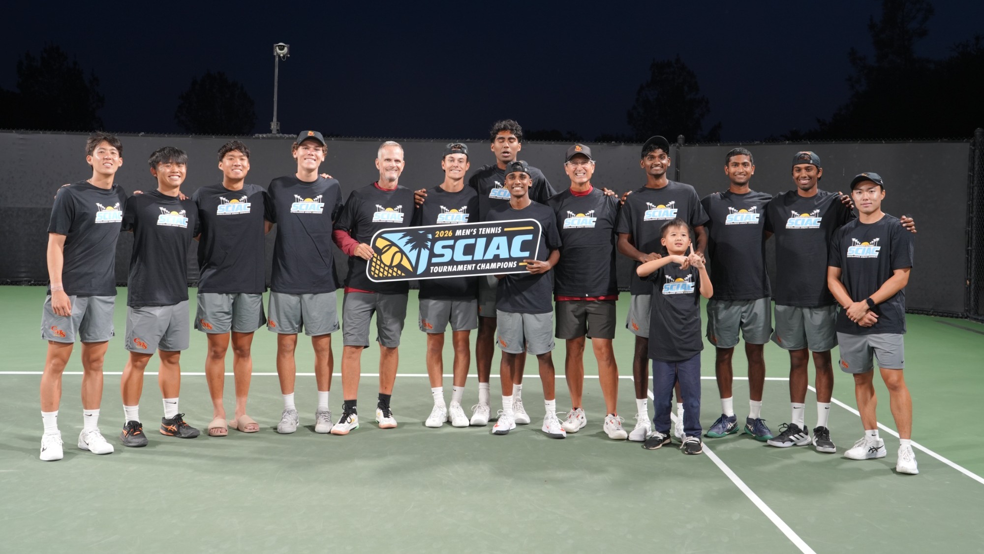CMS Men's Tennis team shot with the SCIAC Championship banner