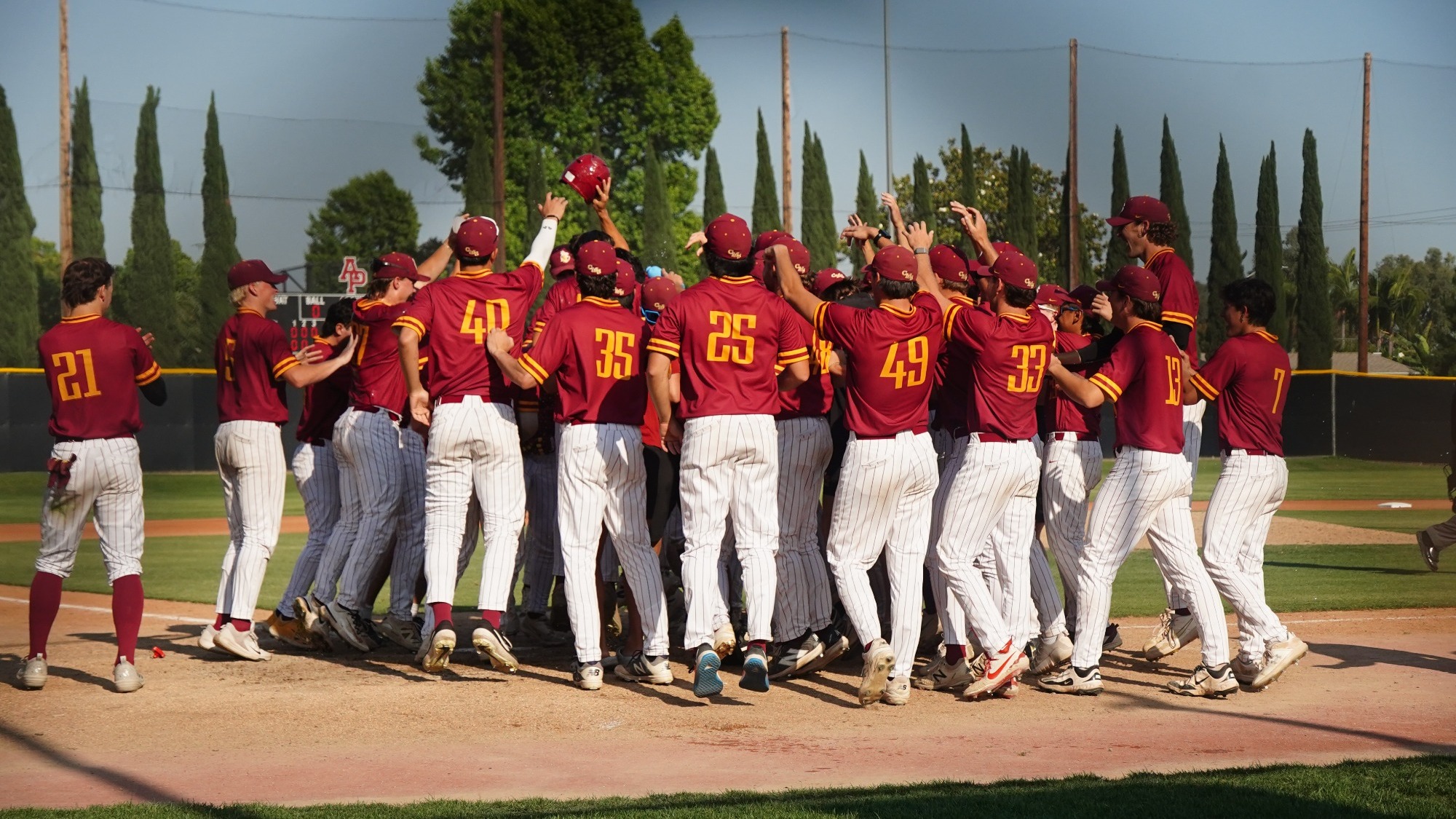 CMS Baseball celebrating at home plate