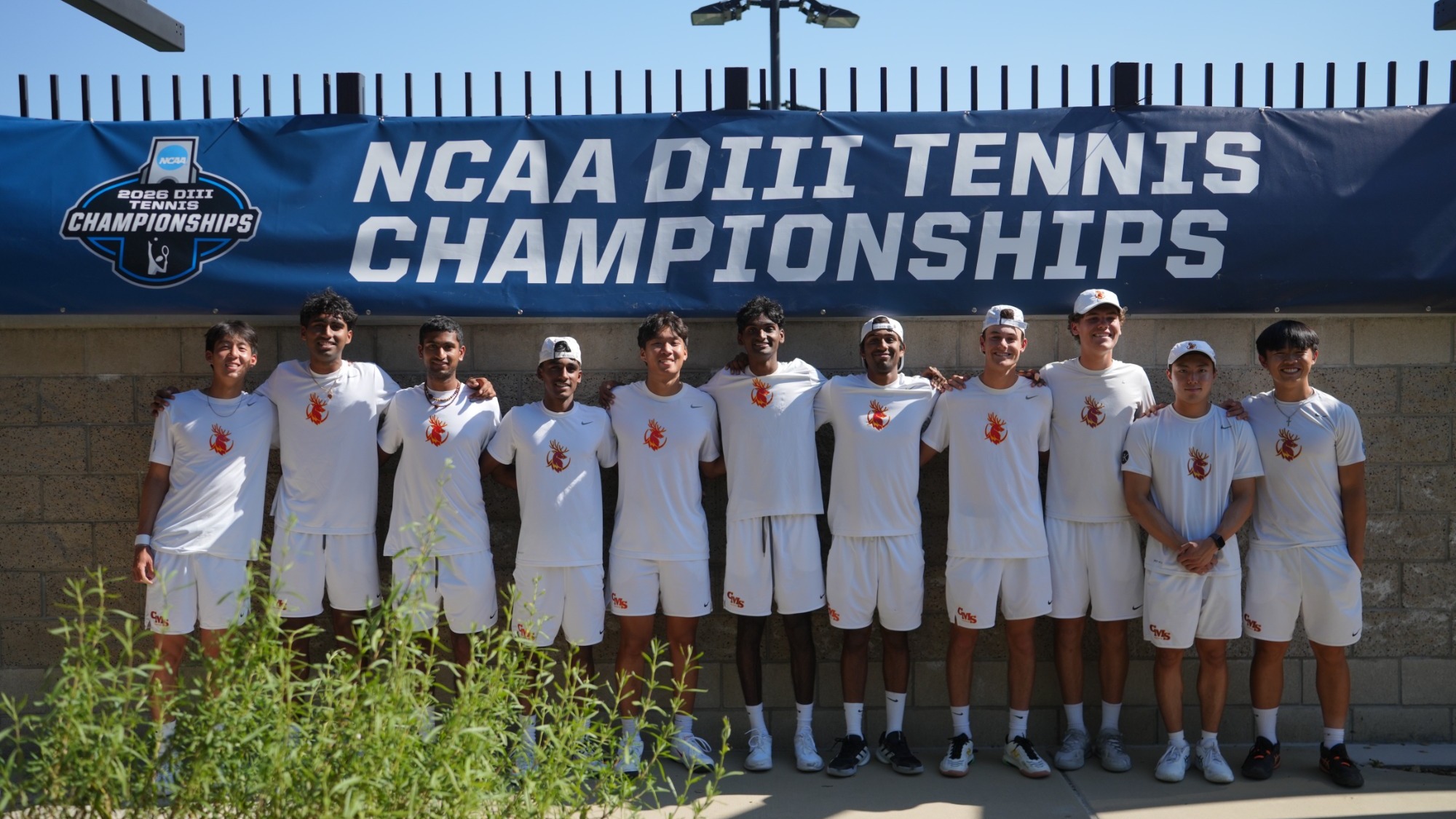 CMS Men's Tennis posing under the NCAA banner
