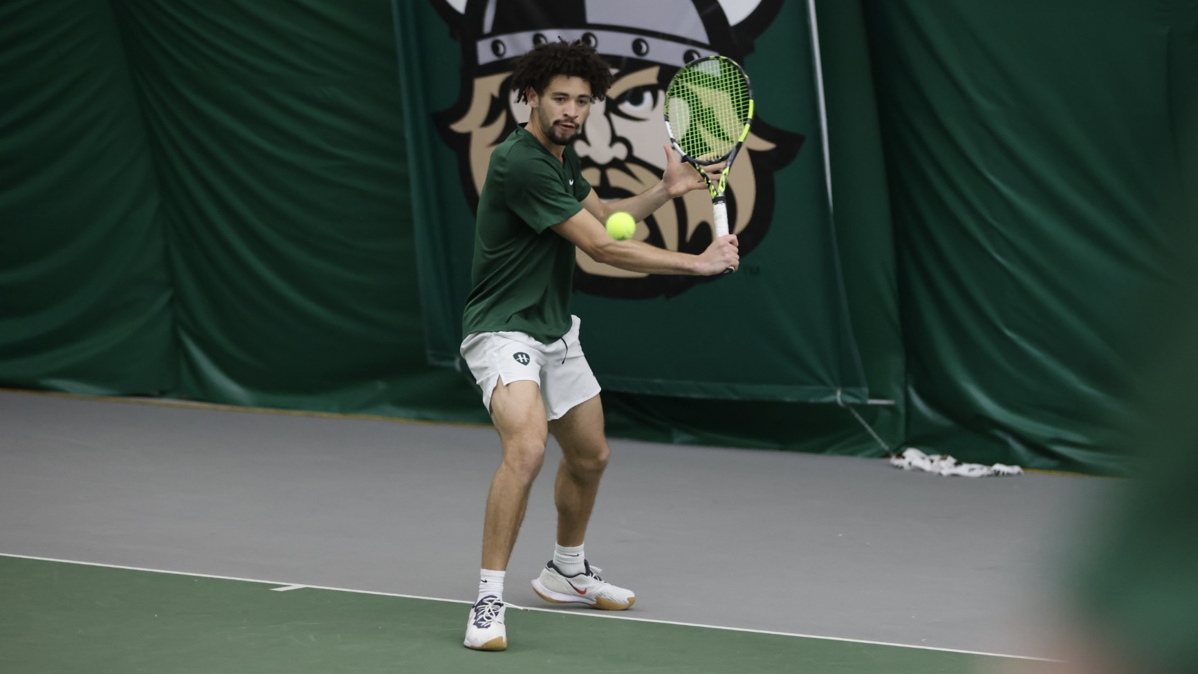Devin Boyer hits a volley against Northern Kentucky