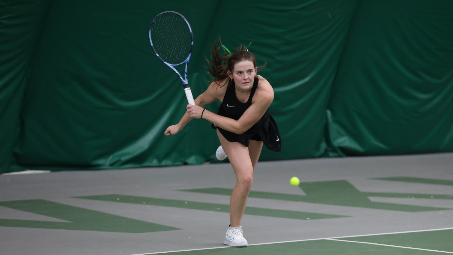 Ella Franz hits a serve