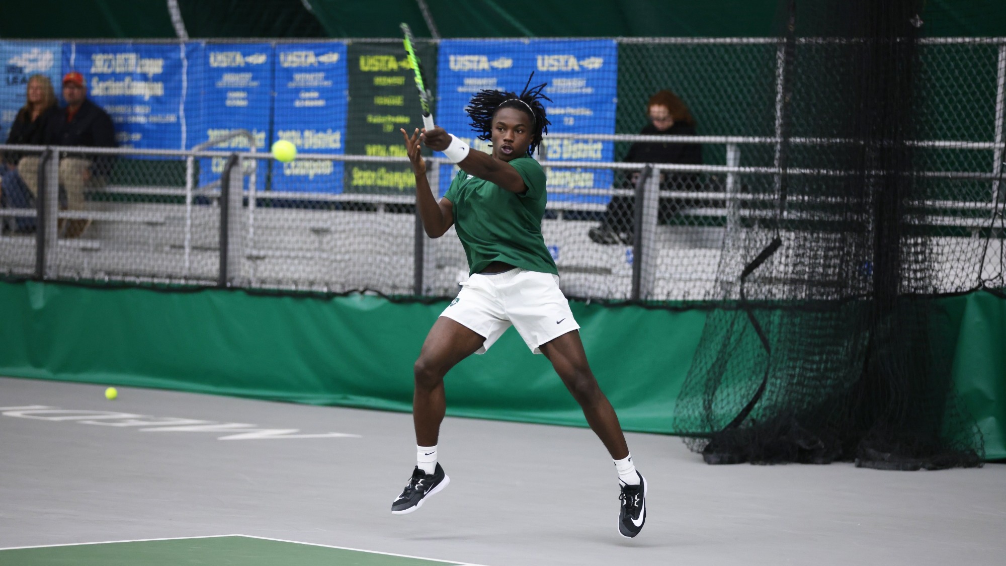 Lincoln Battle hits a forehand down the line