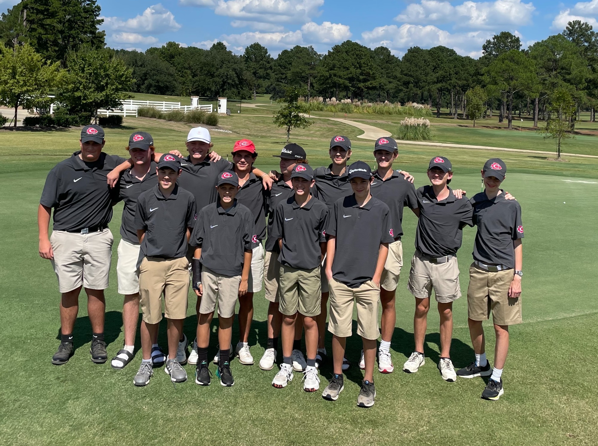The Clinton Golf team celebrates a tournament win at Live Oaks Golf Club in Jackson.