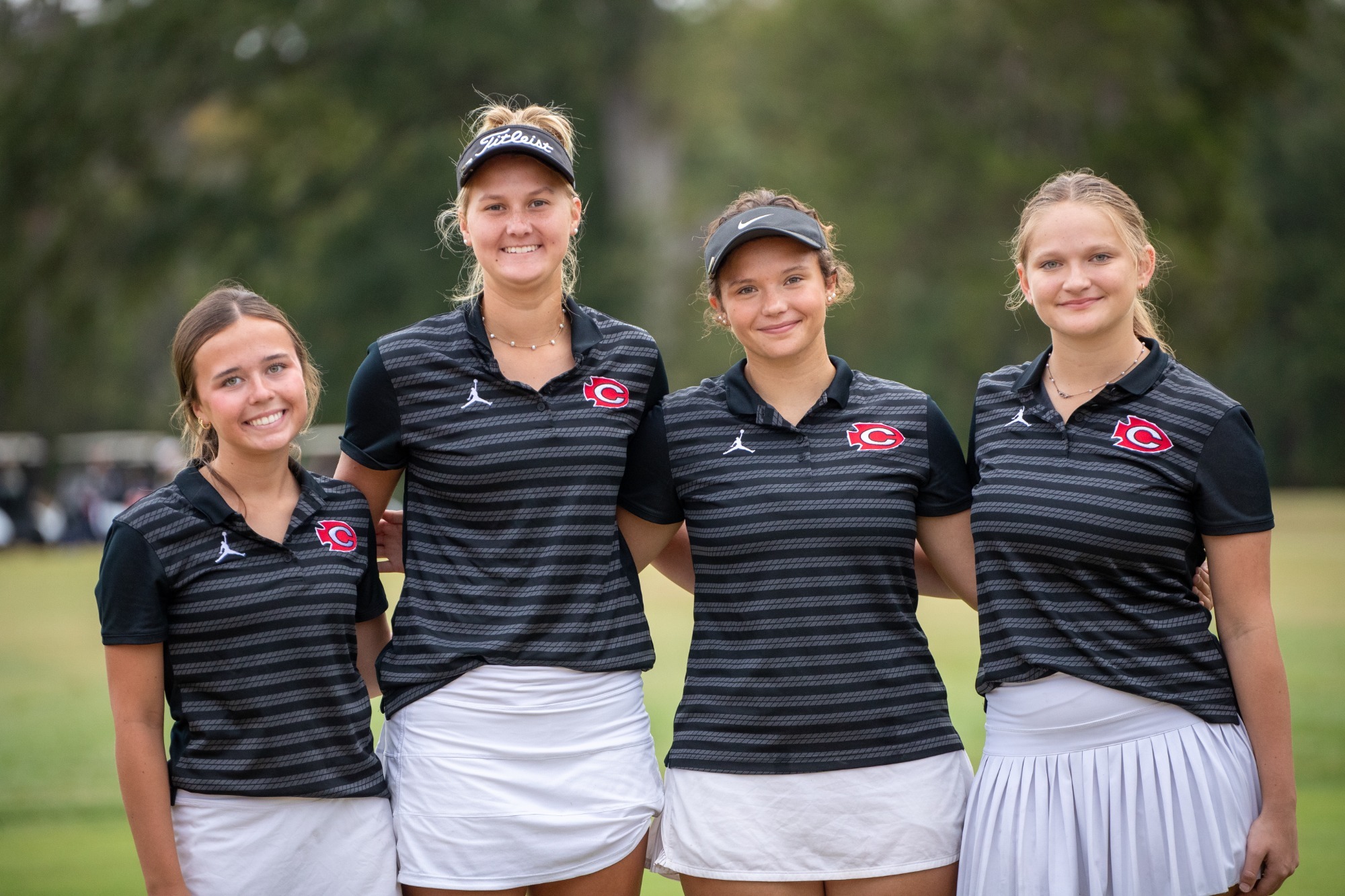 Harper Davis, Ellyn Burchfield, Laney Mitchell, and Kasey Pigg pose for a picture prior to the second round of the MHSAA Class 7A State Tournament.