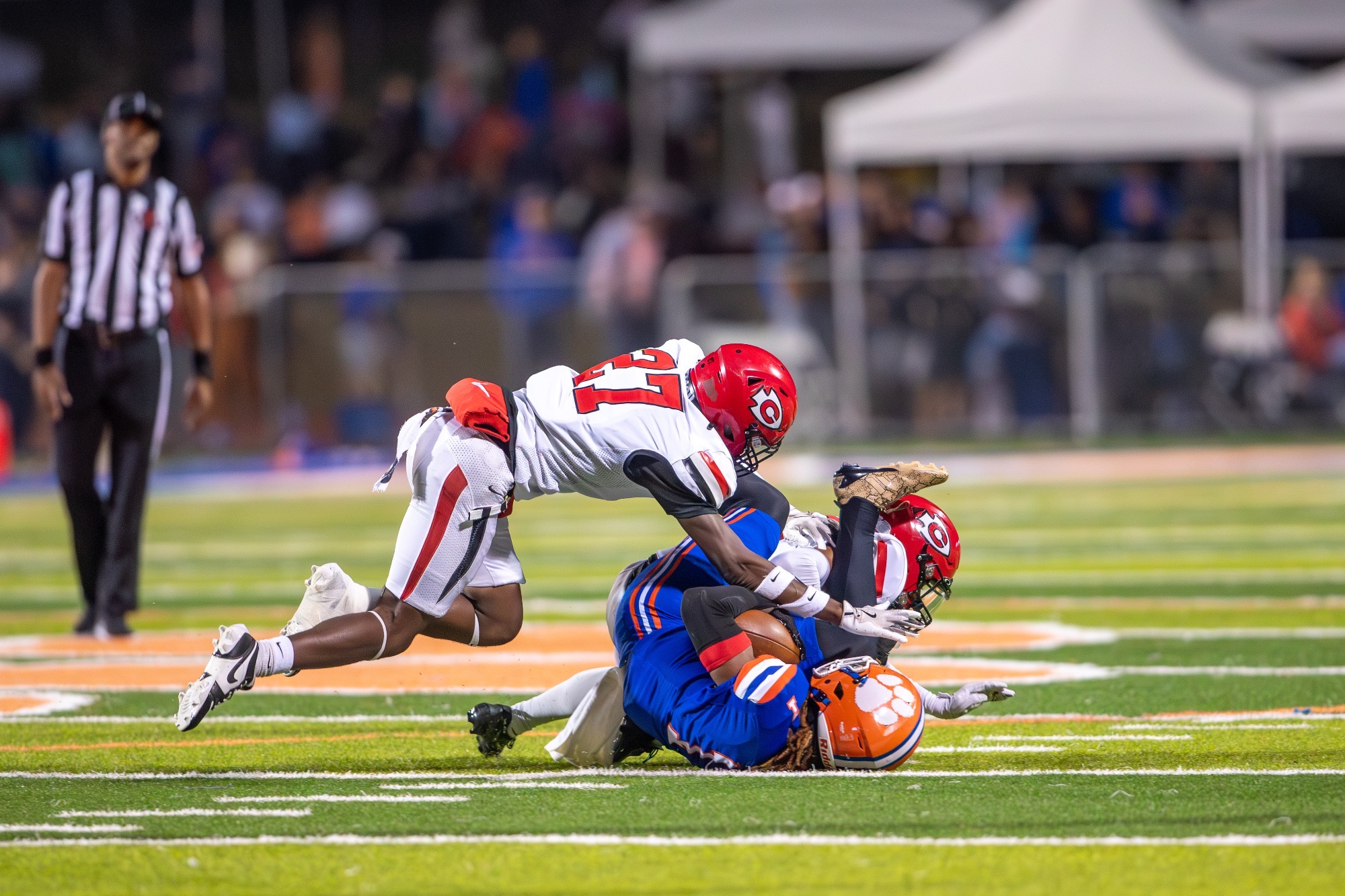 Clinton Arrow defenders bring down a Jaguar on Thursday, November 6, at Jaguar Stadium in Madison.