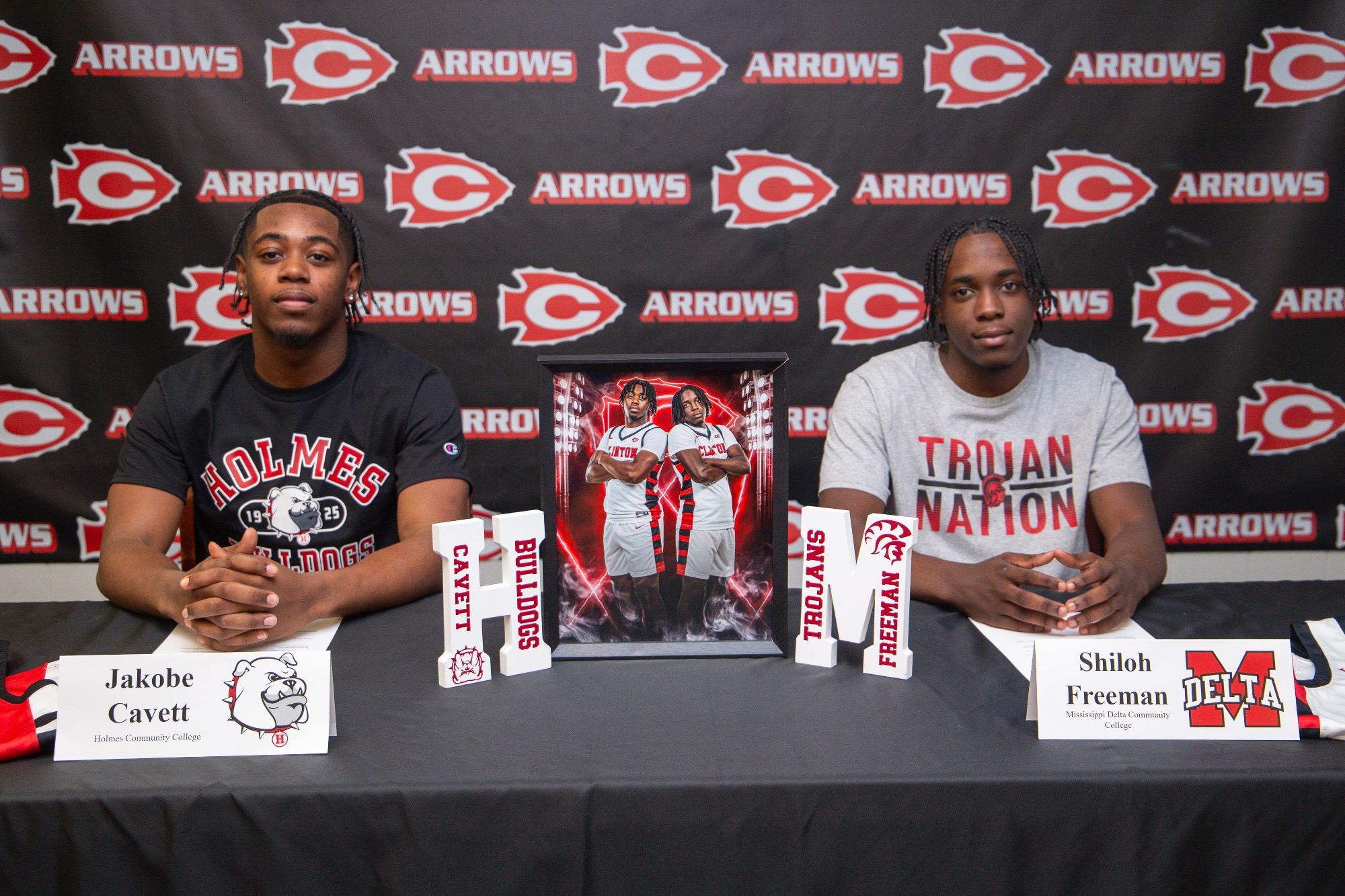 Jakobe Cavett and Shiloh Freeman are brothers who played Clinton Basketball together, but will now split as Cavett signs with Holmes Community College and Freeman signs with Mississippi Delta Community College. 