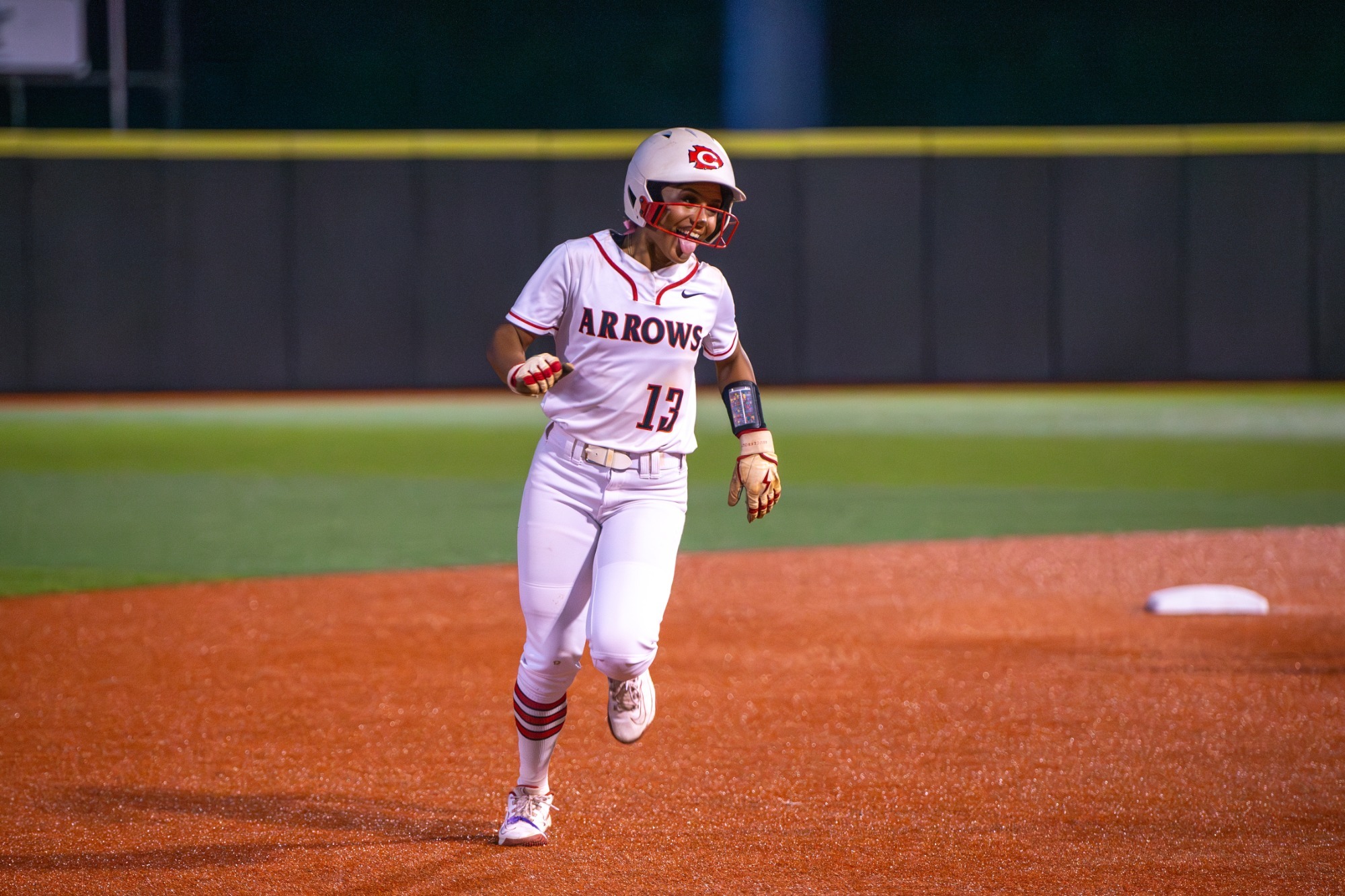 Makenzie Cooley rounds second base after her two-run homer against the DeSoto Central Lady Jaguars.