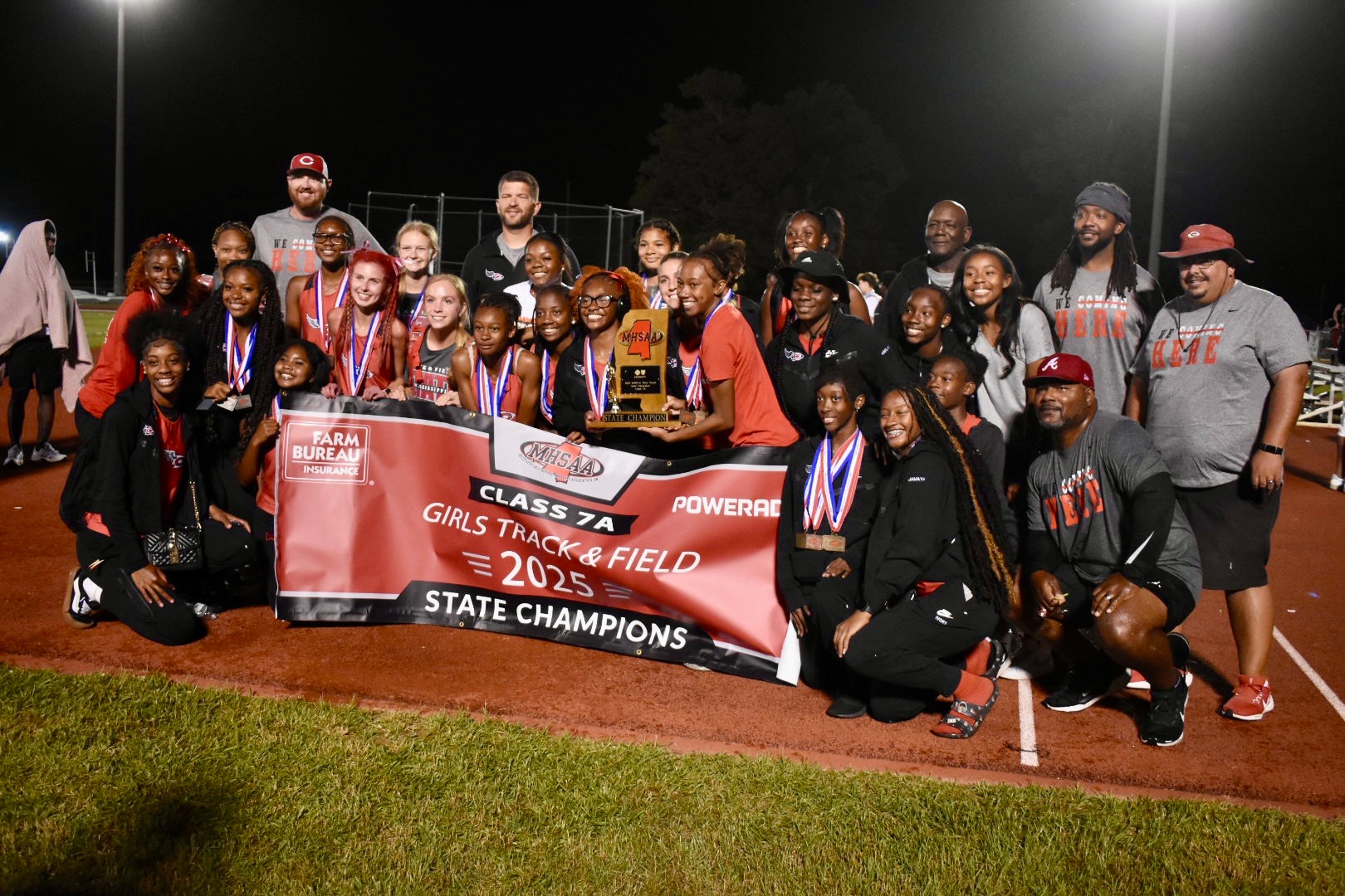 The Clinton Lady Arrows celebrate their 12th straight MHSAA State Title