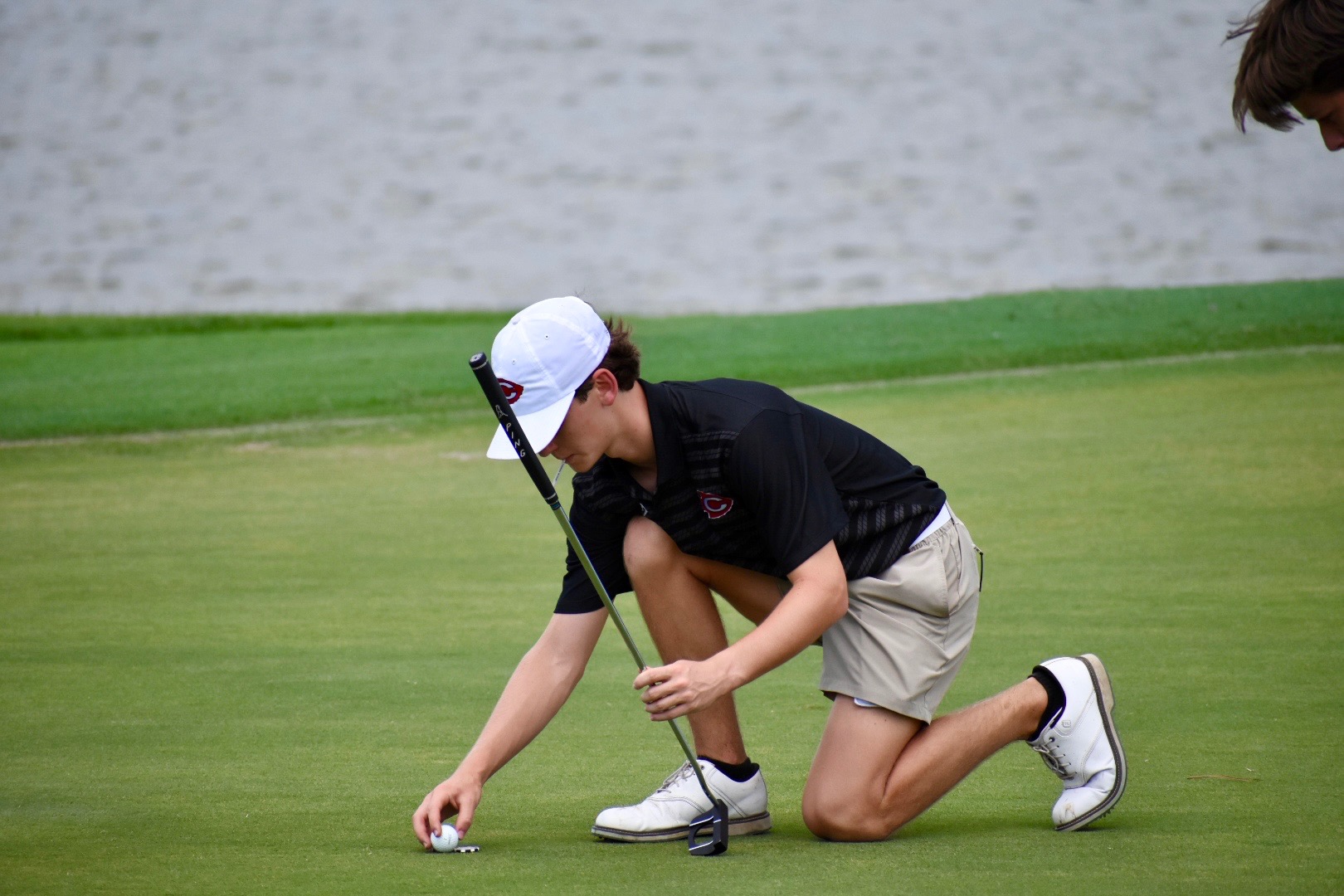 Anderson Schoggin lines up a putt during the Mav Invitational on Wednesday, Aug. 20, in Madison County.