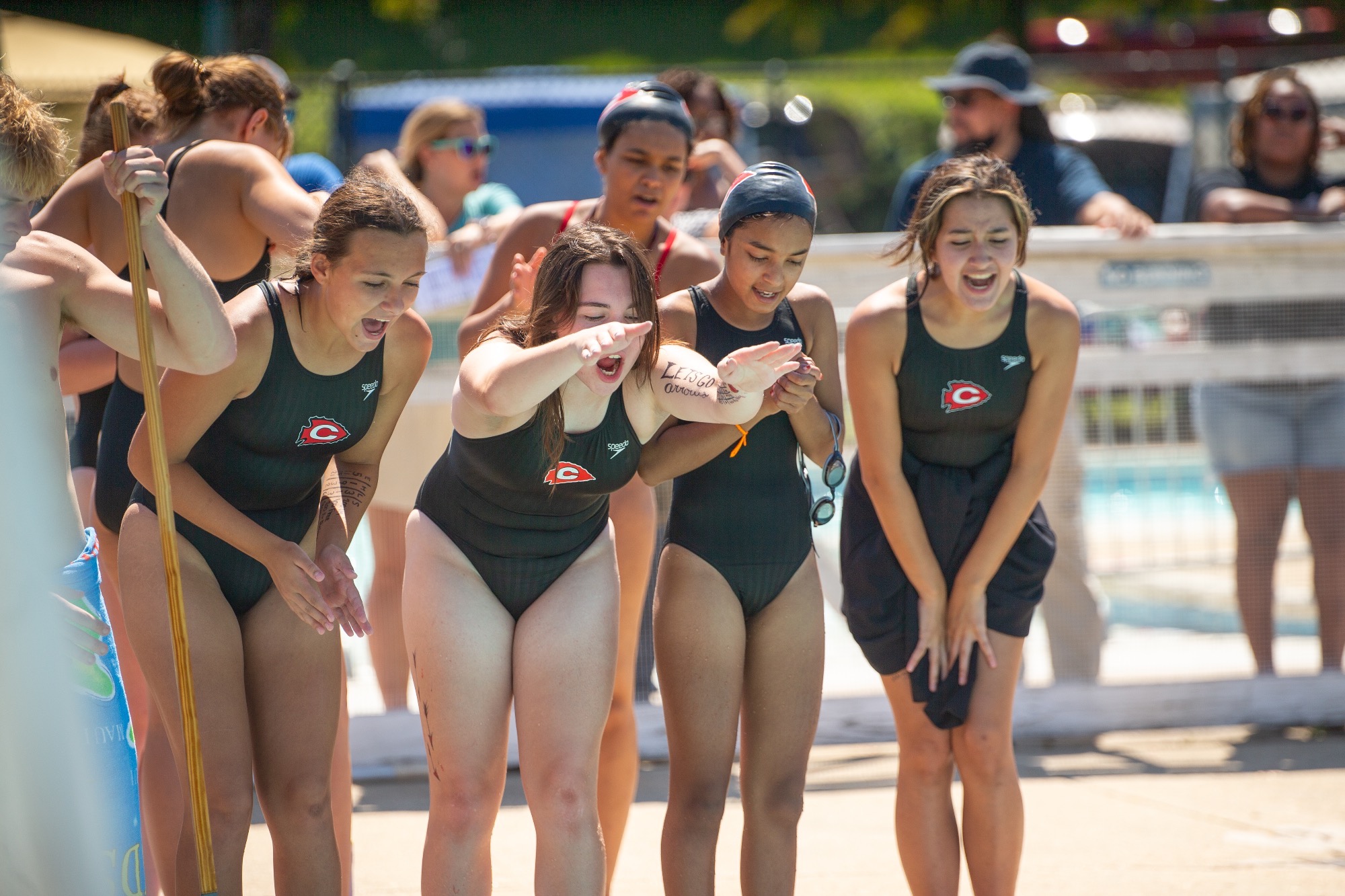 CAST cheers on Clara McCombs during her 500m swim.