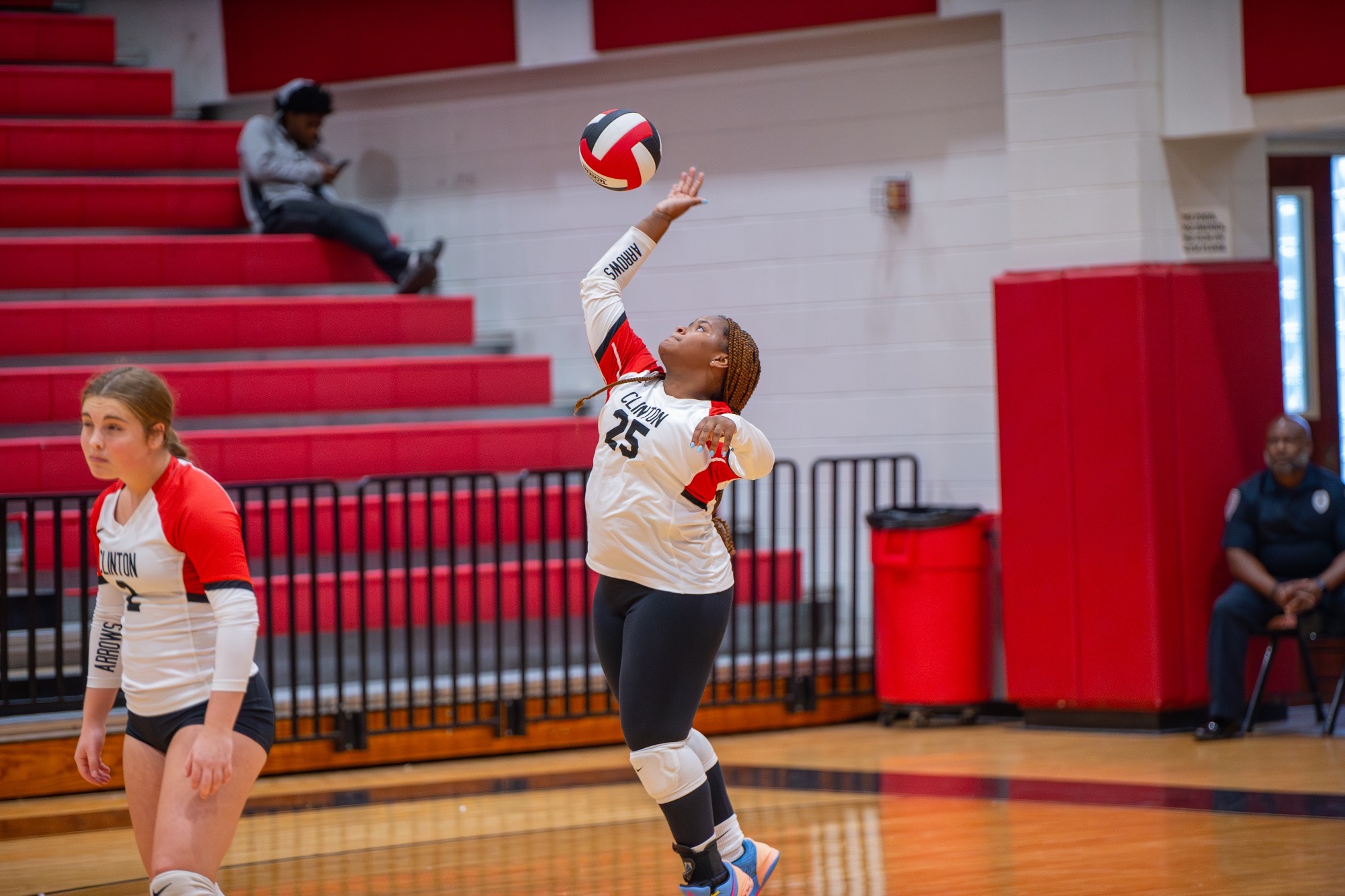 Madison Harris starts a service rally during the opening set of a MHSAA District 2-7A volleyball match against Murrah on Tuesday, August 27, in Clinton