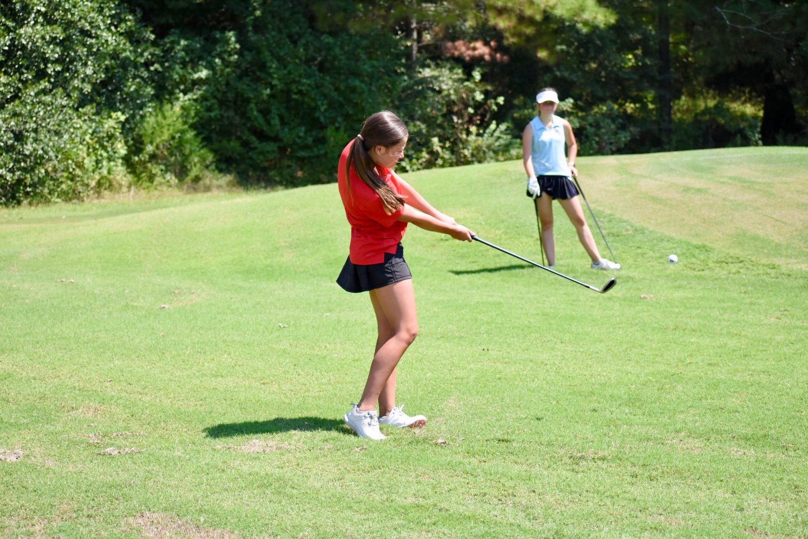 Harper Davis makes her approach shot during the Lady Arrow Invitational at Live Oaks Golf Club in Jackson.